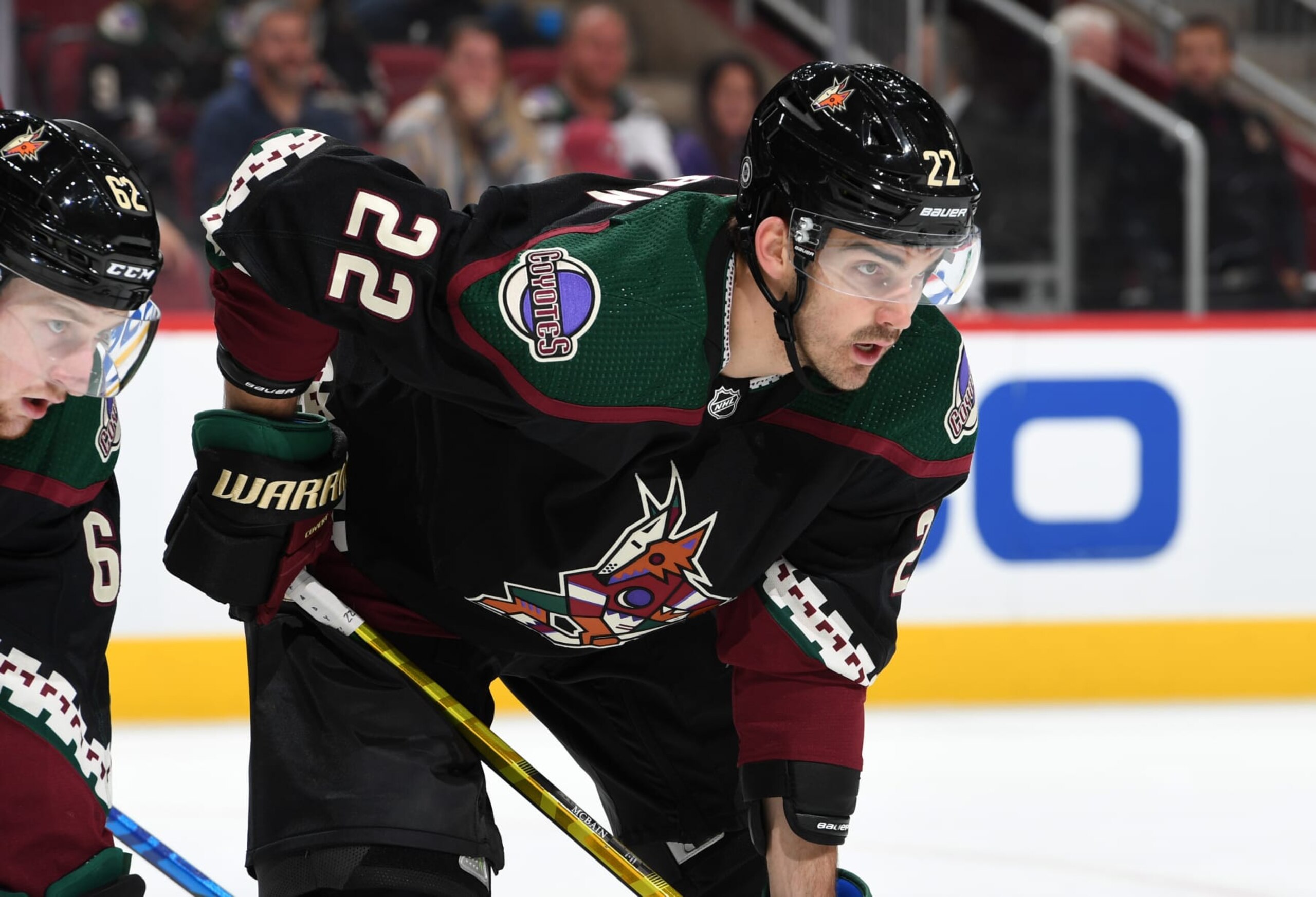 GLENDALE, ARIZONA - APRIL 18: Jack McBain #22 of the Arizona Coyotes gets ready during a face off against the Carolina Hurricanes at Gila River Arena on April 18, 2022 in Glendale, Arizona. (Photo by Norm Hall/NHLI via Getty Images)