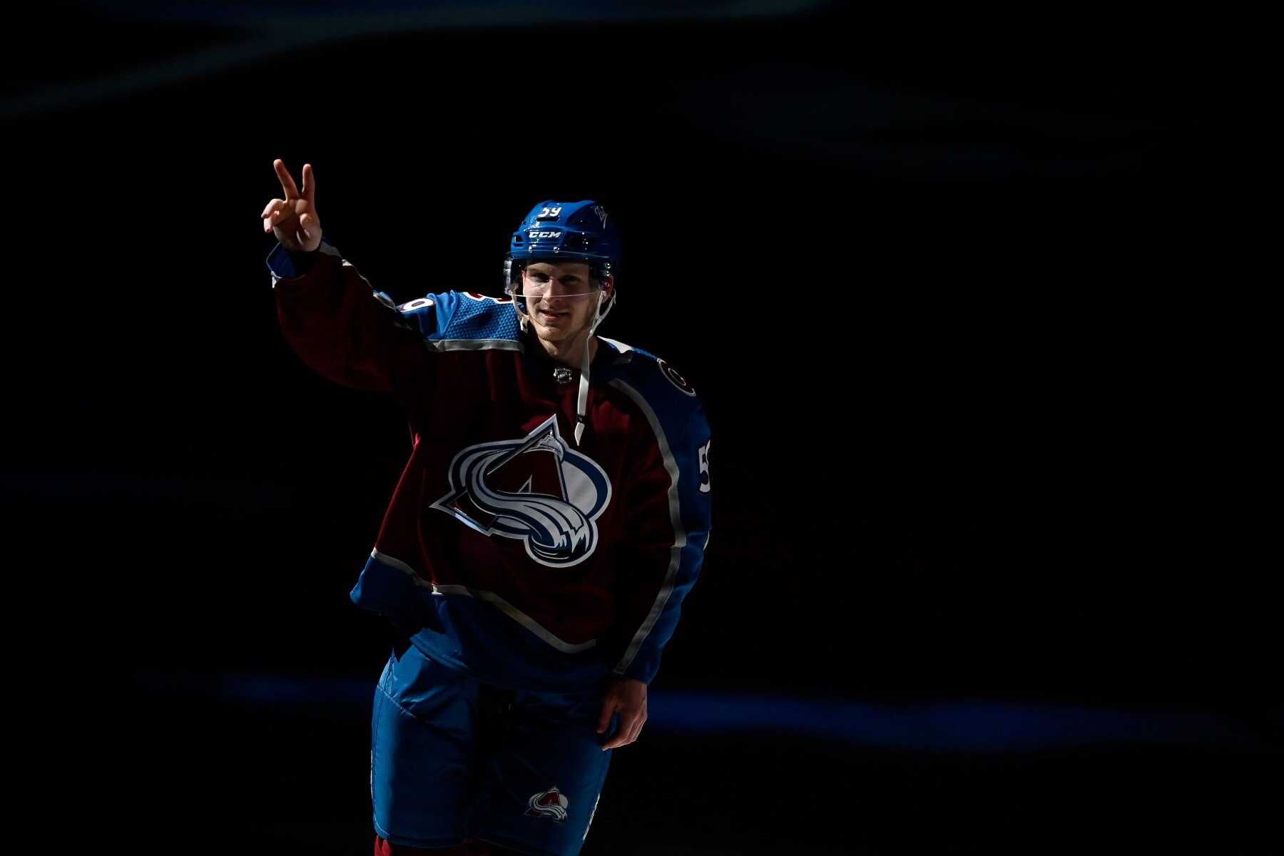 DENVER, COLORADO - APRIL 16:  Ben Meyers #59 of the Colorado Avalanche waves to the crowd as he is announced as the third star of the game after a win over the Carolina Hurricanes at Ball Arena on April 16, 2022 in Denver, Colorado. (Photo by Dustin Bradford/Getty Images)
