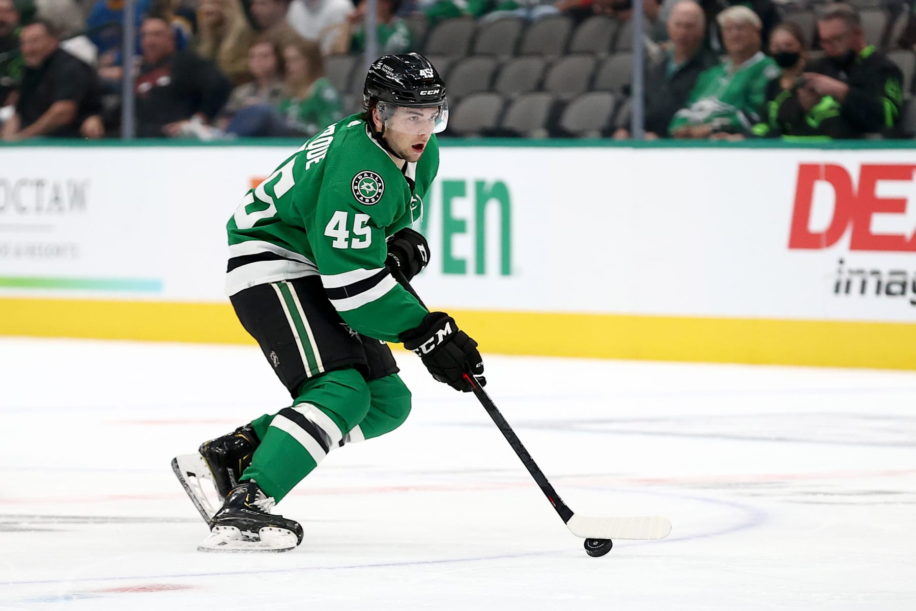 DALLAS, TEXAS - OCTOBER 05: Mavrik Bourque #45 of the Dallas Stars controls the puck against the St. Louis Blues at American Airlines Center on October 05, 2021 in Dallas, Texas. (Photo by Tom Pennington/Getty Images)