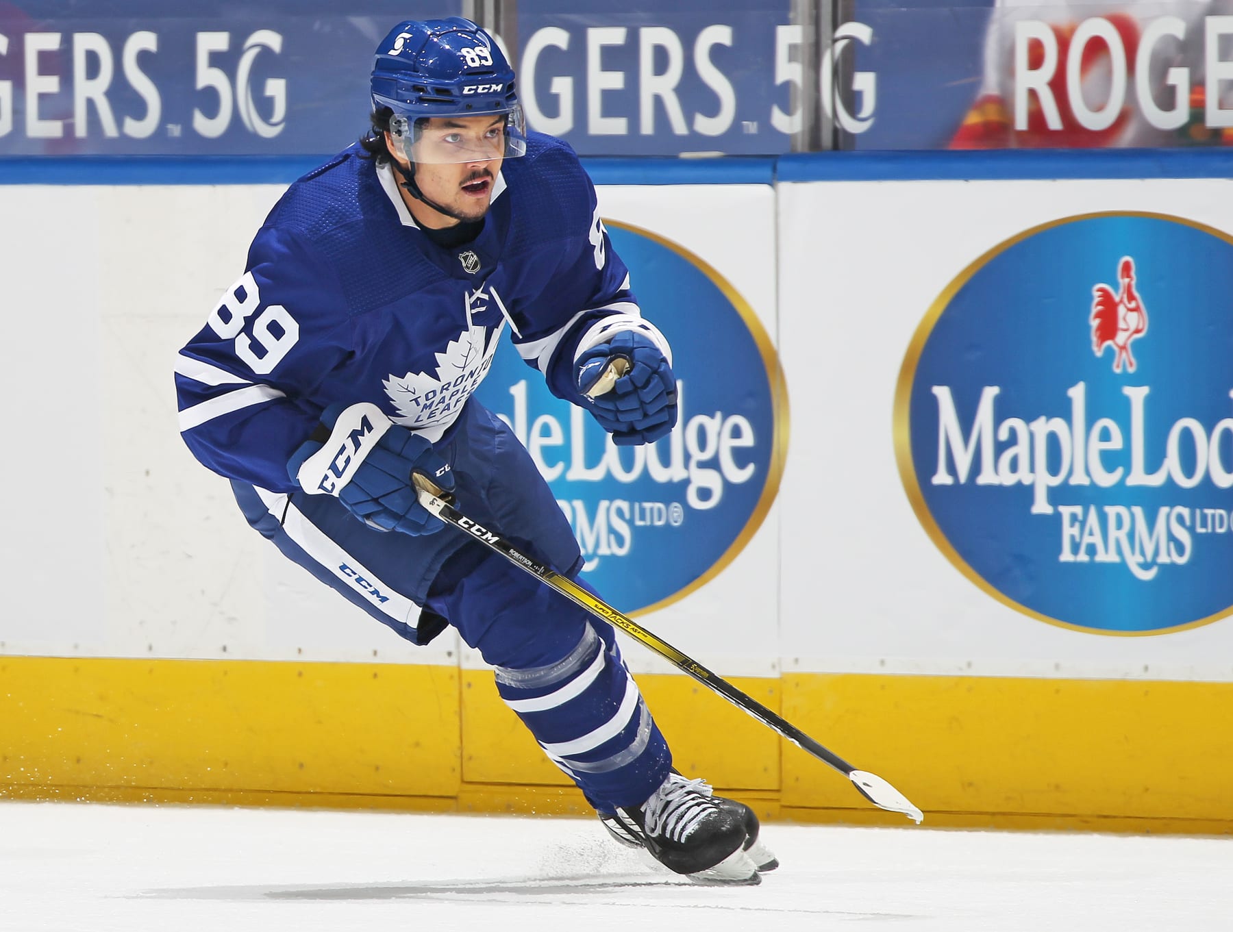 TORONTO, ON - APRIL 13:  Nick Robertson #89 of the Toronto Maple Leafs skates against the Calgary Flames during an NHL game at Scotiabank Arena on April 13, 2021 in Toronto, Ontario, Canada. The Flames defeated the Maple Leafs 3-2 in overtime. (Photo by Claus Andersen/Getty Images)