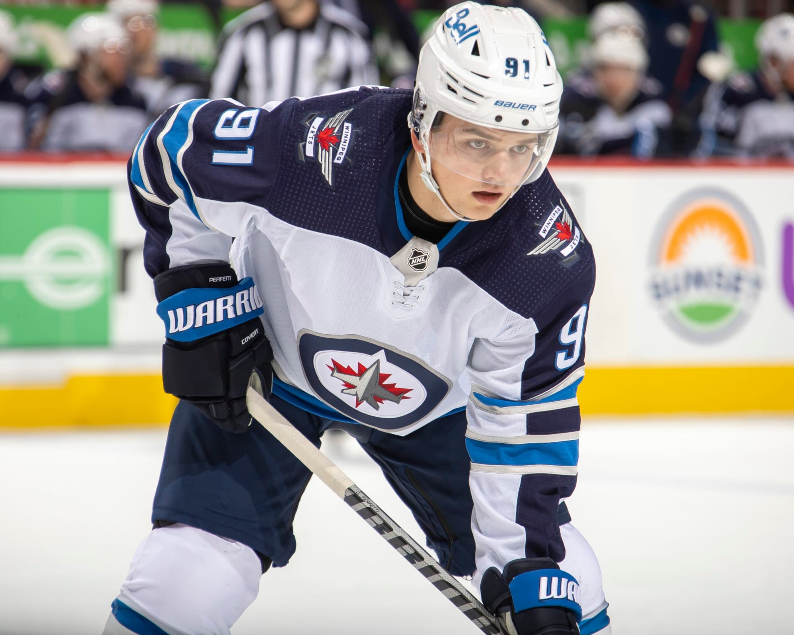 DETROIT, MI - JANUARY 13: Cole Perfetti #91 of the Winnipeg Jets gets set for the face-off against the Detroit Red Wings during the second period of an NHL game at Little Caesars Arena on January 13, 2021 in Detroit, Michigan. Winnipeg defeated Detroit 3-0. (Photo by Dave Reginek/NHLI via Getty Images)