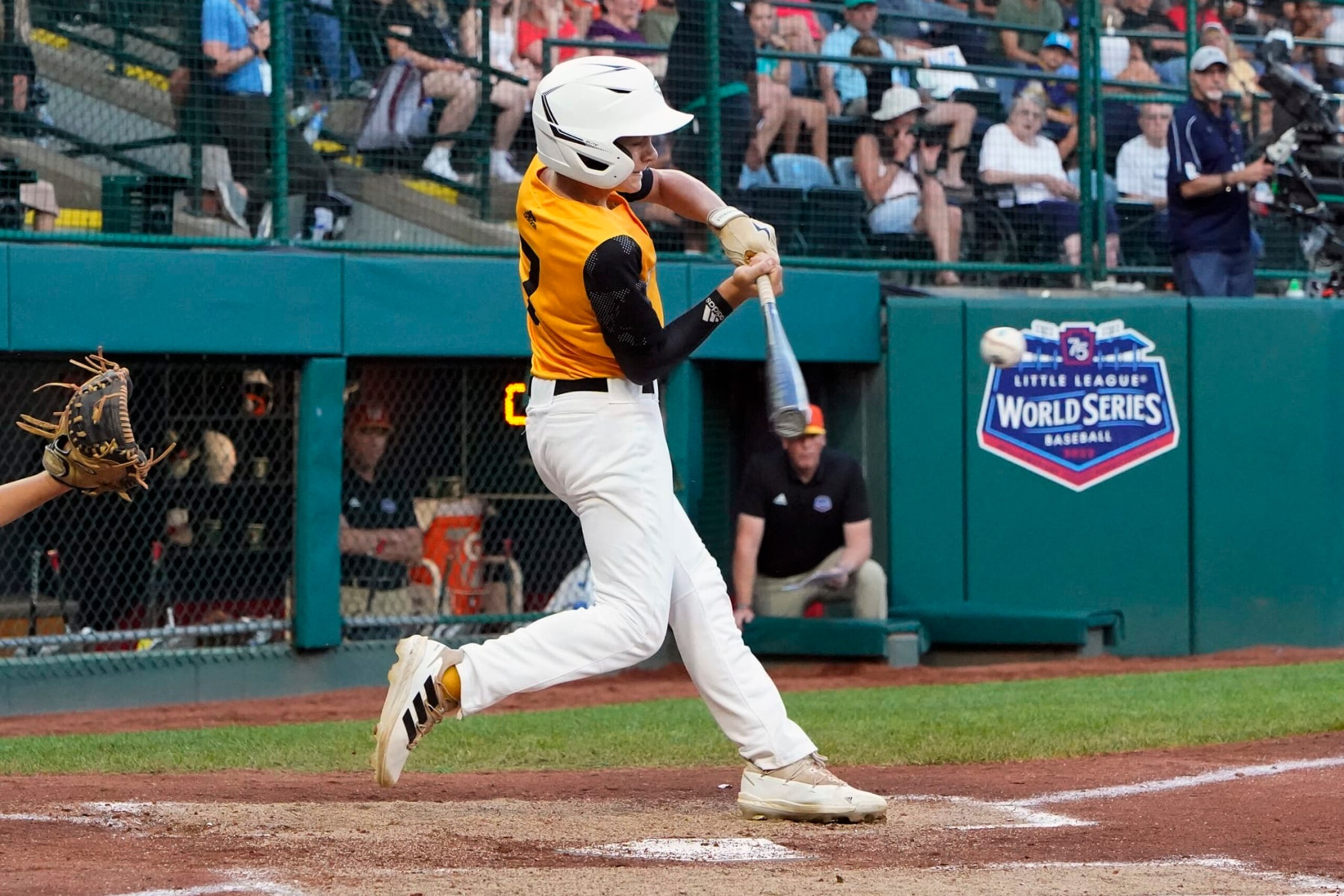 Nolensville, Tenn.'s Josiah Porter follows through on a grand slam during the second inning of a baseball game against Pearland, Texas, at the Little League World Series in South Williamsport, Pa., Thursday, Aug. 25, 2022. (AP Photo/Gene J. Puskar)