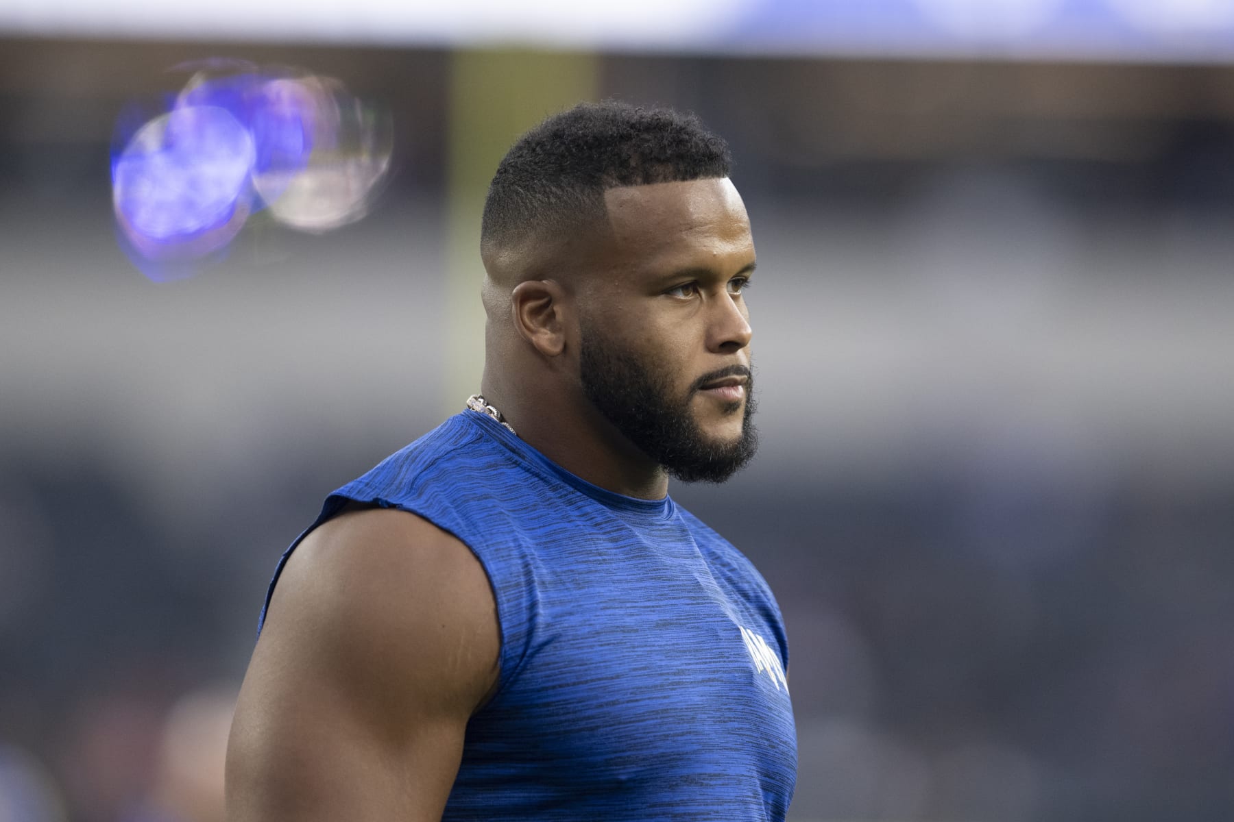 Los Angeles Rams defensive tackle Aaron Donald (99) watches his teammates warm up before an NFL preseason football game against the Houston Texans Friday, Aug. 19, 2022, in Inglewood, Calif. (AP Photo/Kyusung Gong) Los Angeles Rams defensive tackle Aaron Donald (99) watches his teammates warm up before an NFL preseason football game against the Houston Texans Friday, Aug. 19, 2022, in Inglewood, Calif. (AP Photo/Kyusung Gong)