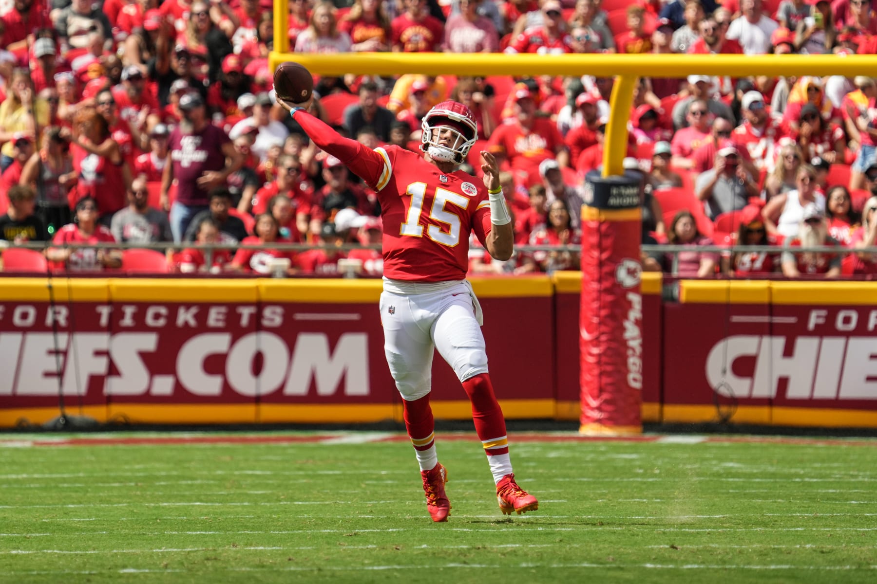 KANSAS CITY, MO - AUGUST 20: Patrick Mahomes #15 of the Kansas City Chiefs throws after rolling out of the pocket during the first quarter of the game against the Washington Commanders at Arrowhead Stadium on August 20, 2022 in Kansas City, Missouri. (Photo by Jason Hanna/Getty Images)