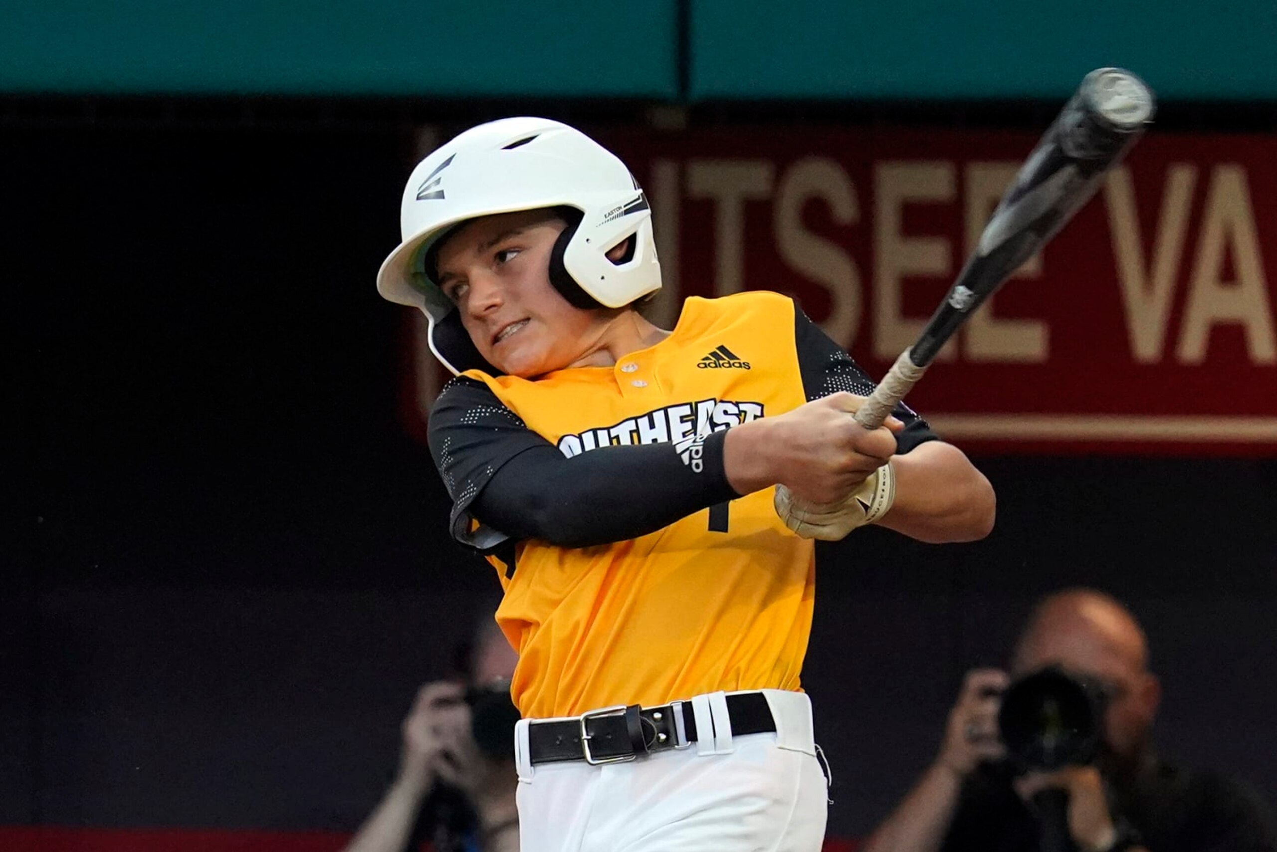 Nolensville, Tenn.'s Josiah Porter follows through on a grand slam during the second inning of a baseball game against Pearland, Texas, at the Little League World Series in South Williamsport, Pa., Thursday, Aug. 25, 2022. (AP Photo/Gene J. Puskar)