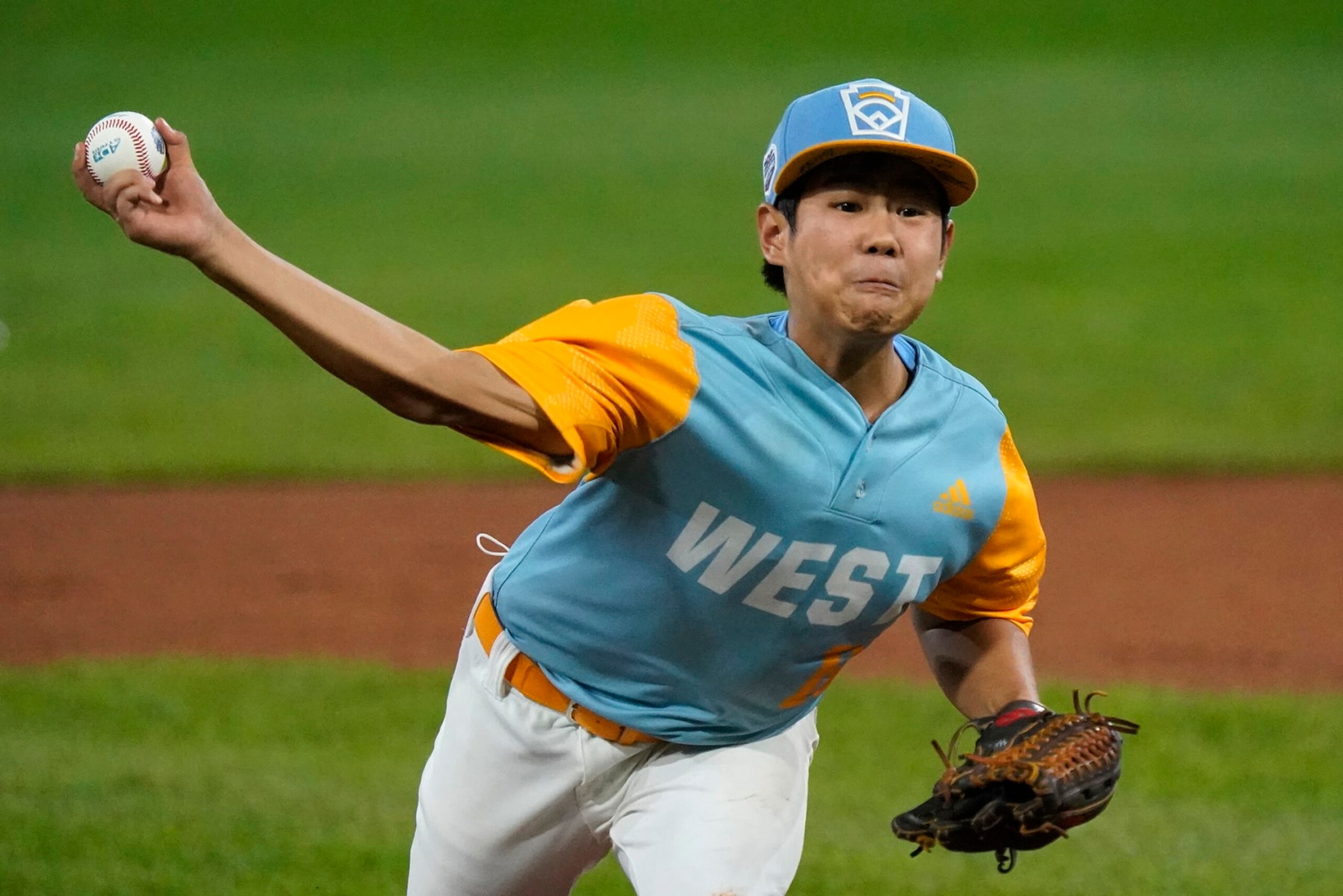 Honolulu's Cohen Sakamoto (16) delivers during the first inning of a baseball game against Pearland, Texas, at the Little League World Series in South Williamsport, Pa., Monday, Aug. 22, 2022. (AP Photo/Gene J. Puskar)