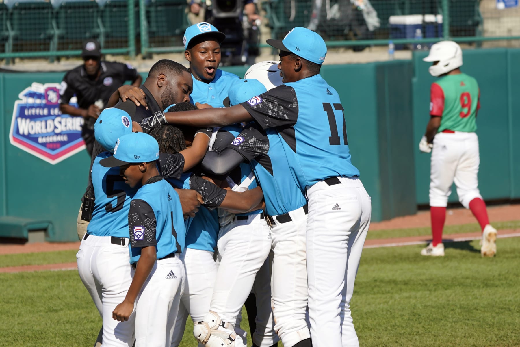 Curacao celebrates after the final out of the game as Mexico's Miguel Padila (9) walks off the field during a baseball game at the Little League World Series tournament in South Williamsport, Pa., Thursday, Aug. 25, 2022. (AP Photo/Tom E. Puskar) Curacao celebrates after the final out of the game as Mexico's Miguel Padila (9) walks off the field during a baseball game at the Little League World Series tournament in South Williamsport, Pa., Thursday, Aug. 25, 2022. (AP Photo/Tom E. Puskar)