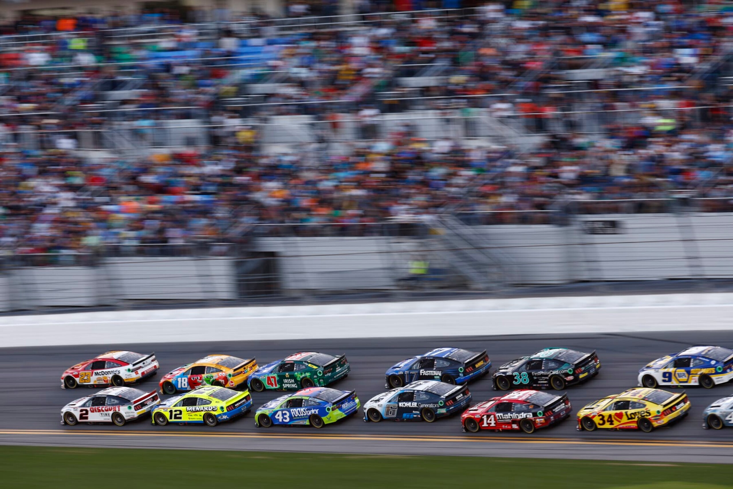 DAYTONA BEACH, FLORIDA - FEBRUARY 20: Bubba Wallace, driver of the #23 McDonald's Toyota, and Austin Cindric, driver of the #2 Discount Tire Ford, lead the field during the NASCAR Cup Series 64th Annual Daytona 500 at Daytona International Speedway on February 20, 2022 in Daytona Beach, Florida. (Photo by Jared C. Tilton/Getty Images)