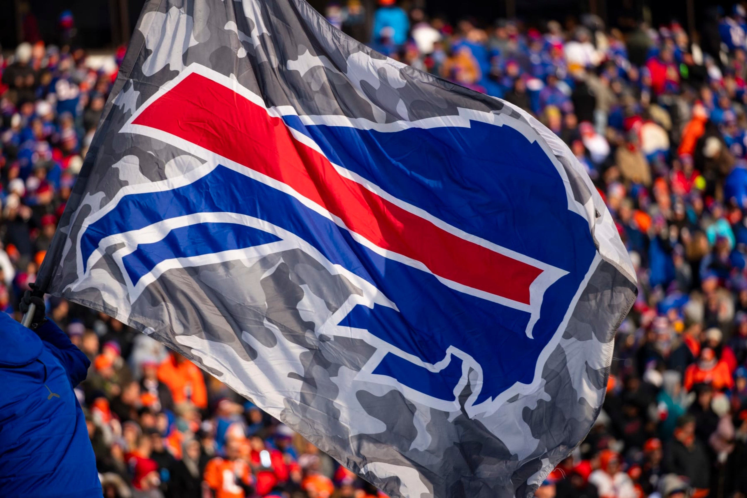 ORCHARD PARK, NY - NOVEMBER 24: Detail view of Buffalo Bills logo on a camouflage flag waved during the second quarter against the Denver Broncos at New Era Field on November 24, 2019 in Orchard Park, New York. Buffalo defeats Denver 20-3. (Photo by Brett Carlsen/Getty Images) ORCHARD PARK, NY - NOVEMBER 24: Detail view of Buffalo Bills logo on a camouflage flag waved during the second quarter against the Denver Broncos at New Era Field on November 24, 2019 in Orchard Park, New York. Buffalo defeats Denver 20-3. (Photo by Brett Carlsen/Getty Images)