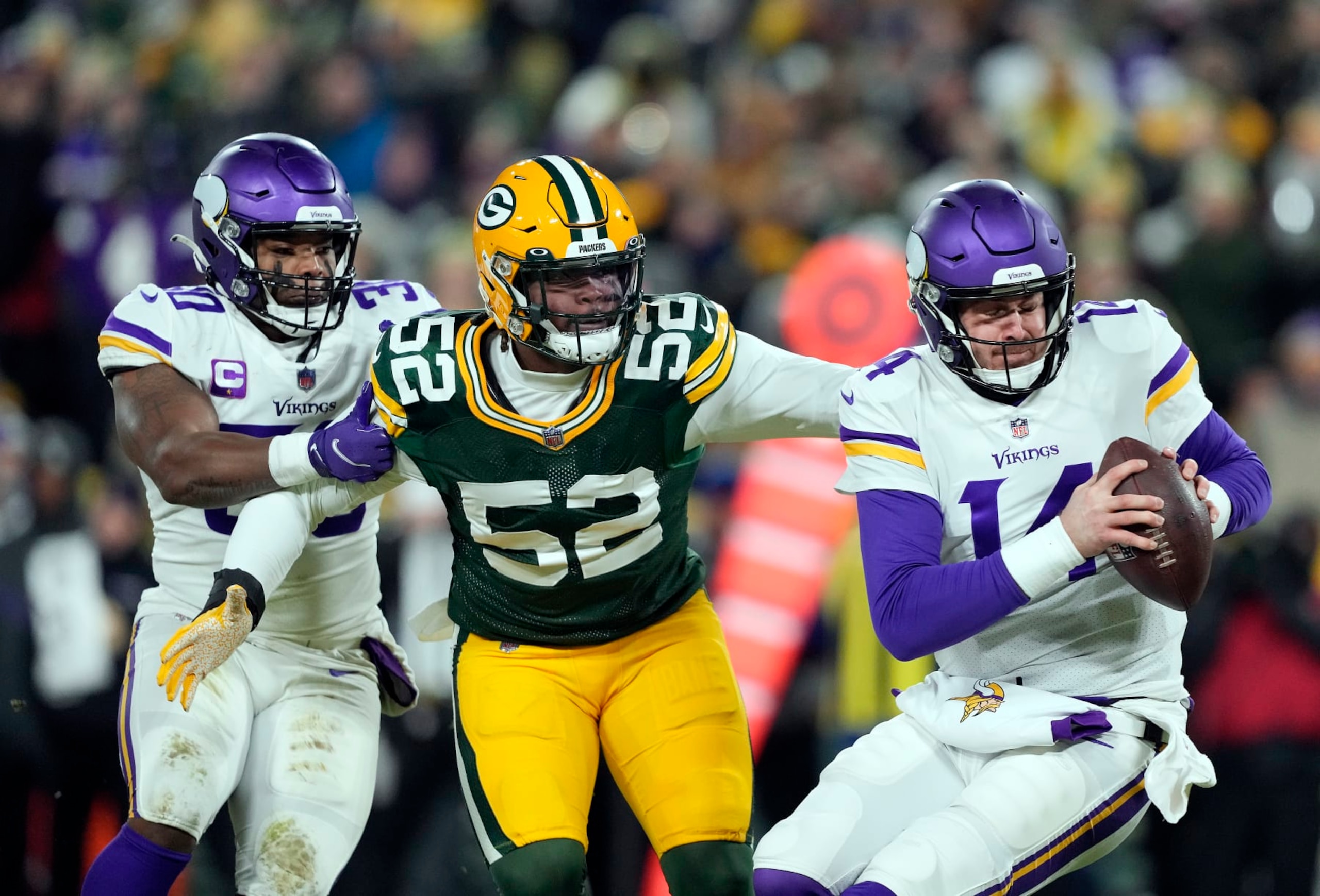 GREEN BAY, WISCONSIN - JANUARY 02: Quarterback Sean Mannion #14 of the Minnesota Vikings is sacked by outside linebacker Rashan Gary #52 of the Green Bay Packers during the 2nd quarter of the game at Lambeau Field on January 02, 2022 in Green Bay, Wisconsin. (Photo by Patrick McDermott/Getty Images) GREEN BAY, WISCONSIN - JANUARY 02: Quarterback Sean Mannion #14 of the Minnesota Vikings is sacked by outside linebacker Rashan Gary #52 of the Green Bay Packers during the 2nd quarter of the game at Lambeau Field on January 02, 2022 in Green Bay, Wisconsin. (Photo by Patrick McDermott/Getty Images)