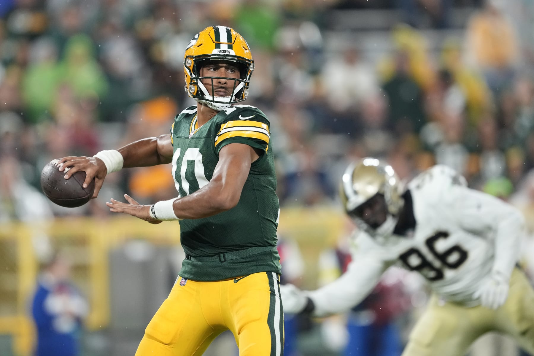GREEN BAY, WISCONSIN - AUGUST 19: Jordan Love #10 of the Green Bay Packers throws a pass against the New Orleans Saints in the second half during a preseason game at Lambeau Field on August 19, 2022 in Green Bay, Wisconsin. (Photo by Patrick McDermott/Getty Images)