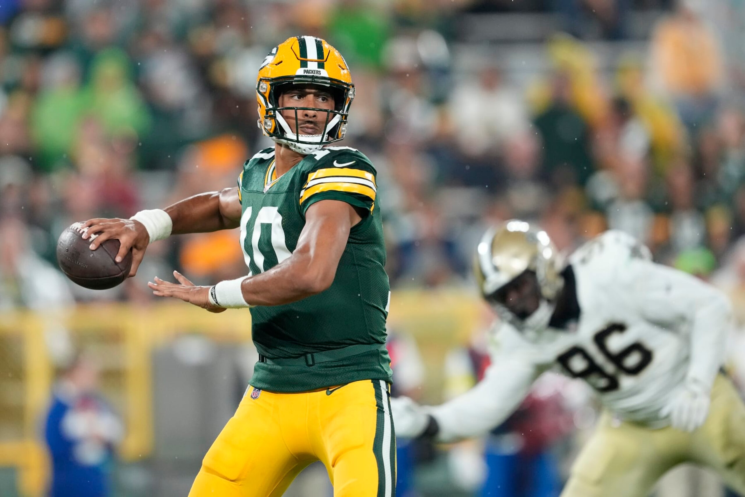 GREEN BAY, WISCONSIN - AUGUST 19: Jordan Love #10 of the Green Bay Packers throws a pass against the New Orleans Saints in the second half during a preseason game at Lambeau Field on August 19, 2022 in Green Bay, Wisconsin. (Photo by Patrick McDermott/Getty Images)