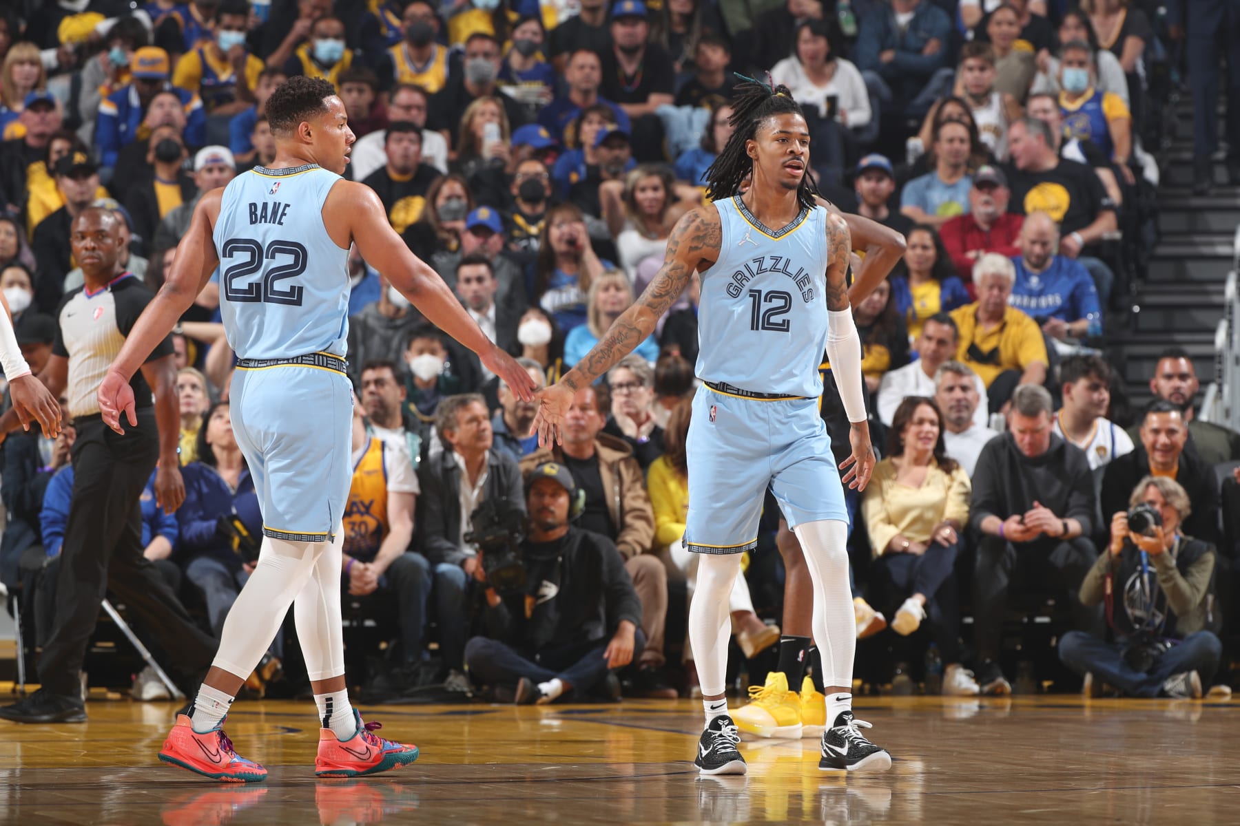 SAN FRANCISCO, CA - MAY 7: Desmond Bane #22 of the Memphis Grizzlies high fives Ja Morant #12 of the Memphis Grizzlies during Game 3 of the 2022 NBA Playoffs Western Conference Semifinals on May 7, 2022 at Chase Center in San Francisco, California. NOTE TO USER: User expressly acknowledges and agrees that, by downloading and or using this photograph, user is consenting to the terms and conditions of Getty Images License Agreement. Mandatory Copyright Notice: Copyright 2022 NBAE (Photo by Joe Murphy/NBAE via Getty Images)