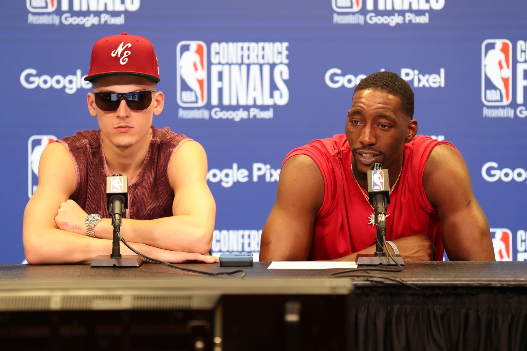 MIAMI, FL - MAY 17: Tyler Herro #14 and Bam Adebayo #13 of the Miami Heat talk to the press after Game 1 of the 2022 NBA Playoffs Eastern Conference Finals against the Boston Celtics on May 17, 2022 at FTX Arena in Miami, Florida. NOTE TO USER: User expressly acknowledges and agrees that, by downloading and or using this Photograph, user is consenting to the terms and conditions of the Getty Images License Agreement. Mandatory Copyright Notice: Copyright 2022 NBAE (Photo by Issac Baldizon/NBAE via Getty Images)