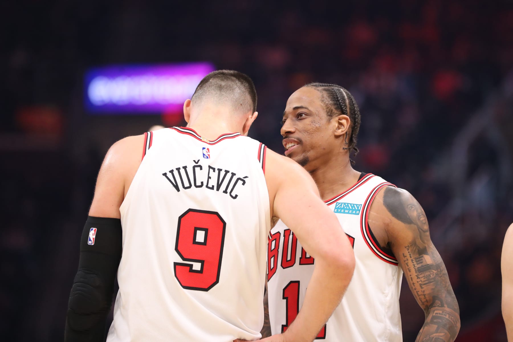 CLEVELAND, OH - MARCH 25: Nikola Vucevic #9 and DeMar DeRozan #11 of the Chicago Bulls speak during the game against the Cleveland Cavaliers on March 25, 2022 at Rocket Mortgage FieldHouse in Cleveland, Ohio. NOTE TO USER: User expressly acknowledges and agrees that, by downloading and/or using this Photograph, user is consenting to the terms and conditions of the Getty Images License Agreement. Mandatory Copyright Notice: Copyright 2022 NBAE (Photo by  Lauren Bacho/NBAE via Getty Images)