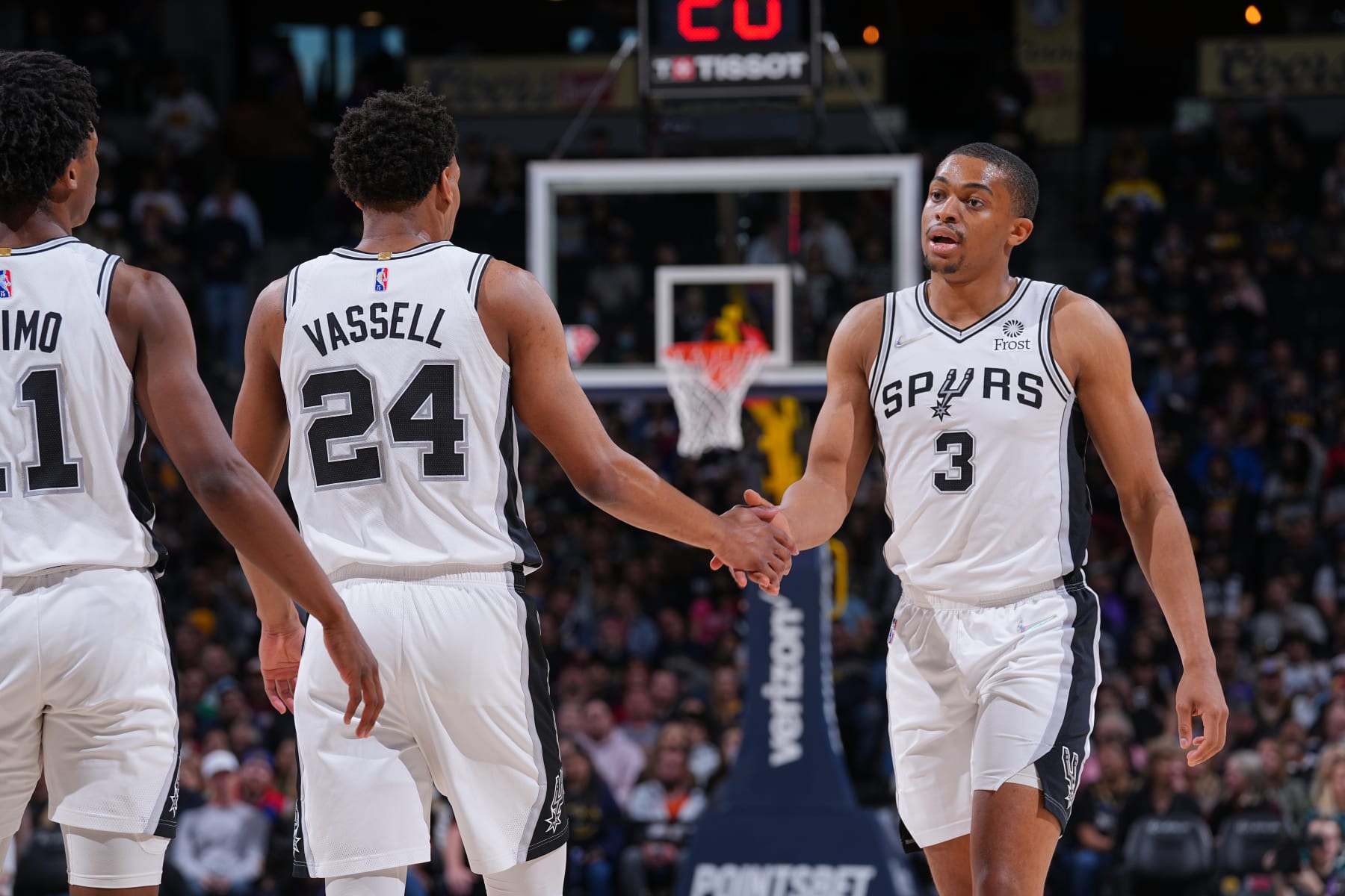 DENVER, CO - APRIL 5: Devin Vassell #24 and Keldon Johnson #3 of the San Antonio Spurs high five during the game against the Denver Nuggets on April 5, 2022 at the Ball Arena in Denver, Colorado. NOTE TO USER: User expressly acknowledges and agrees that, by downloading and/or using this Photograph, user is consenting to the terms and conditions of the Getty Images License Agreement. Mandatory Copyright Notice: Copyright 2022 NBAE (Photo by Bart Young/NBAE via Getty Images)