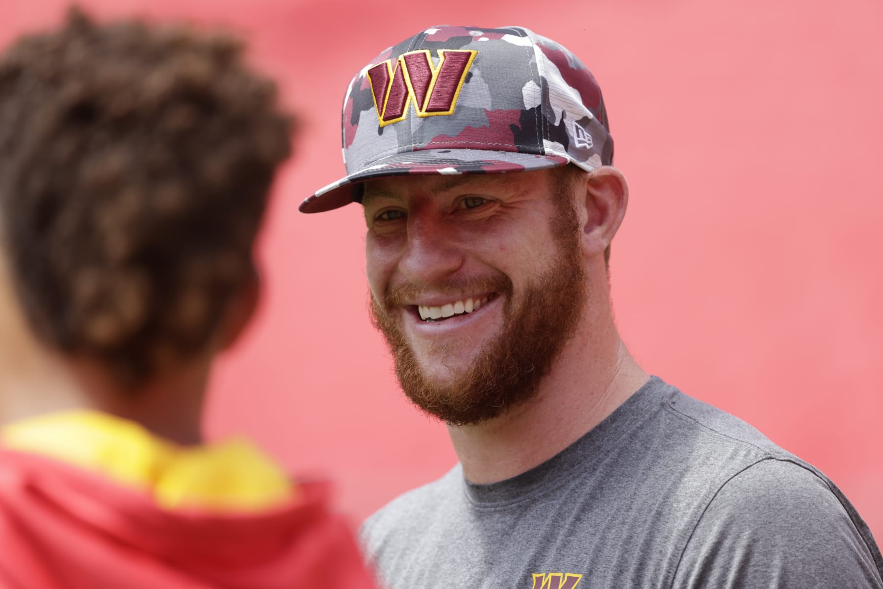 KANSAS CITY, MO - AUGUST 20: Carson Wentz #11 of the Washington Commanders speaks with Patrick Mahomes #15 of the Kansas City Chiefs prior to their preseason game at Arrowhead Stadium on August 20, 2022 in Kansas City, Missouri. (Photo by David Eulitt/Getty Images)