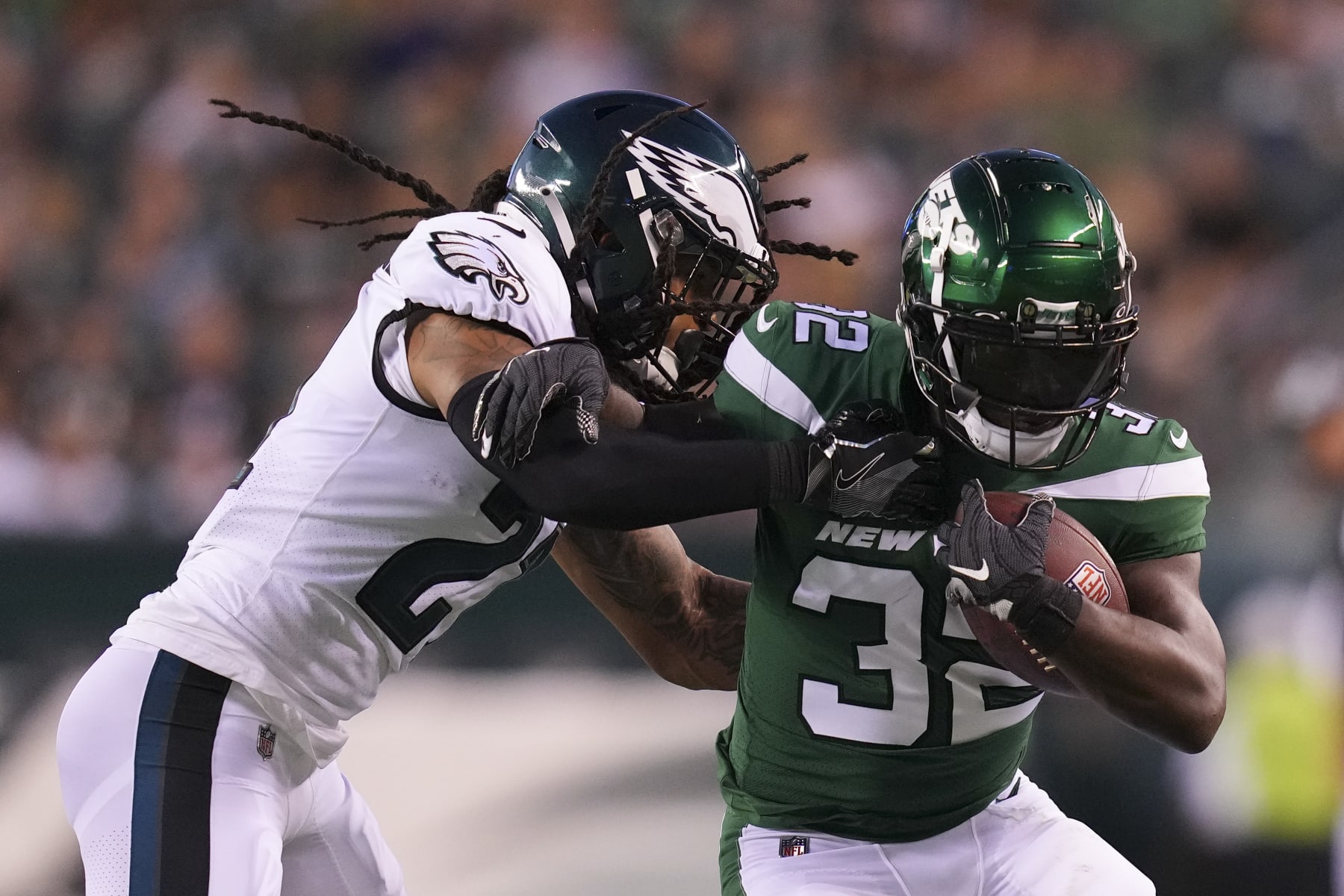PHILADELPHIA, PA - AUGUST 12: Michael Carter #32 of the New York Jets runs the ball and is pushed out of bounds by Andre Chachere #21 of the Philadelphia Eagles in the first half of the preseason game at Lincoln Financial Field on August 12, 2022 in Philadelphia, Pennsylvania. (Photo by Mitchell Leff/Getty Images)