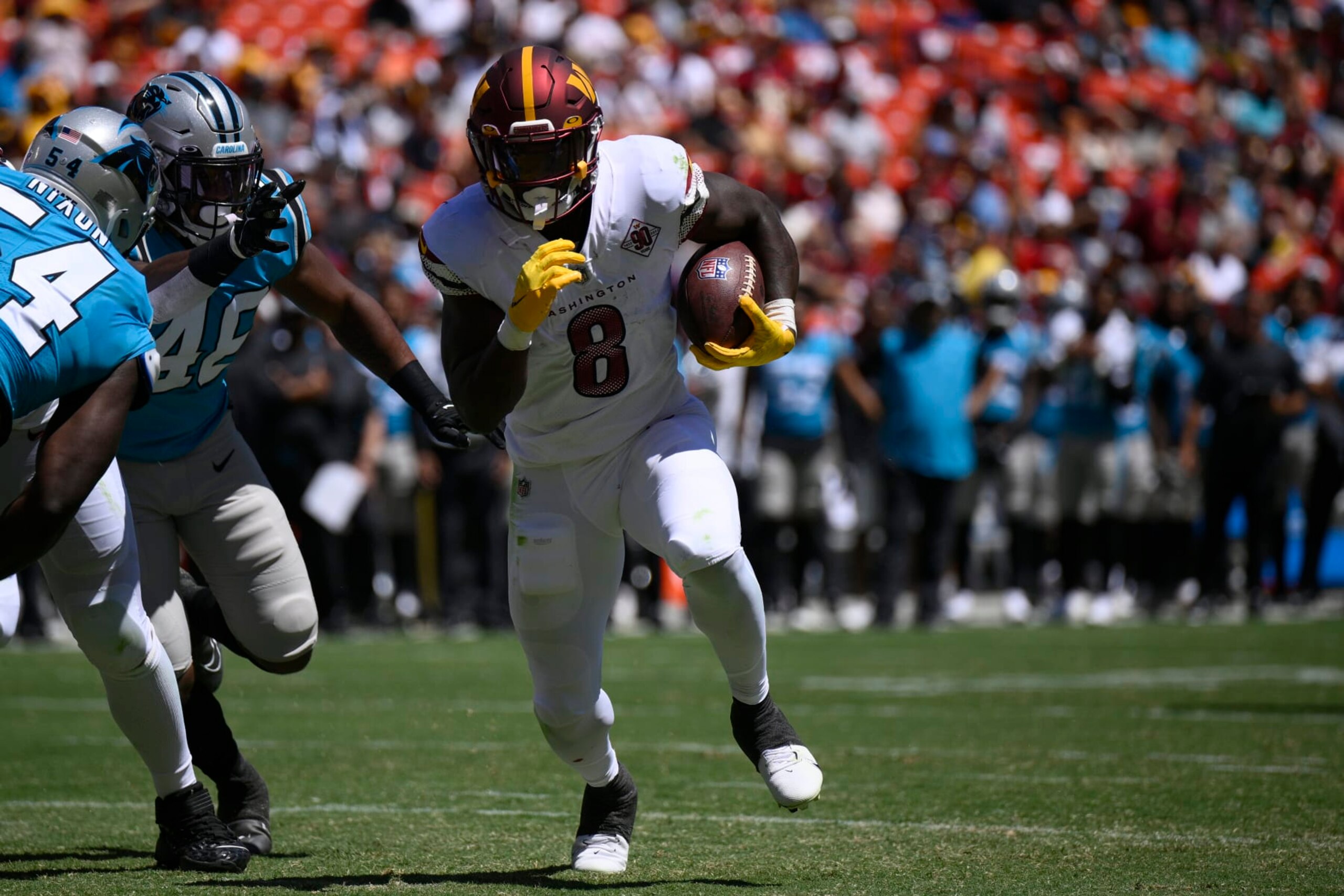 Washington Commanders running back Brian Robinson (8) runs with the ball during the first half of a preseason NFL football game against the Carolina Panthers, Saturday, Aug. 13, 2022, in Landover, Md. (AP Photo/Nick Wass)
