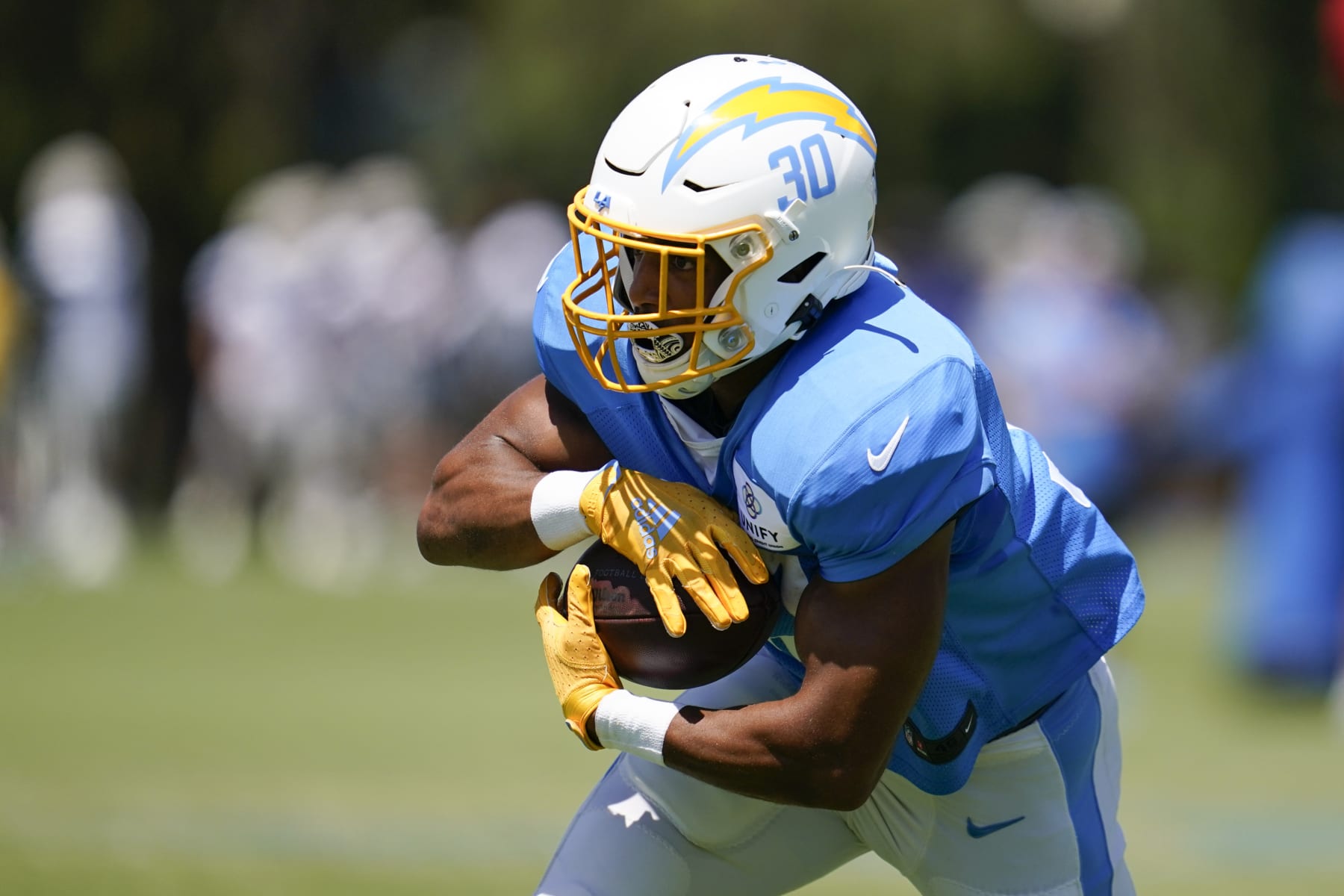 Los Angeles Chargers running back Austin Ekeler (30) participates in drills during a combined NFL practice with the Dallas Cowboys at the Los Angeles Rams' practice facility in Costa Mesa, Calif. Thursday, Aug. 18, 2022. (AP Photo/Ashley Landis)