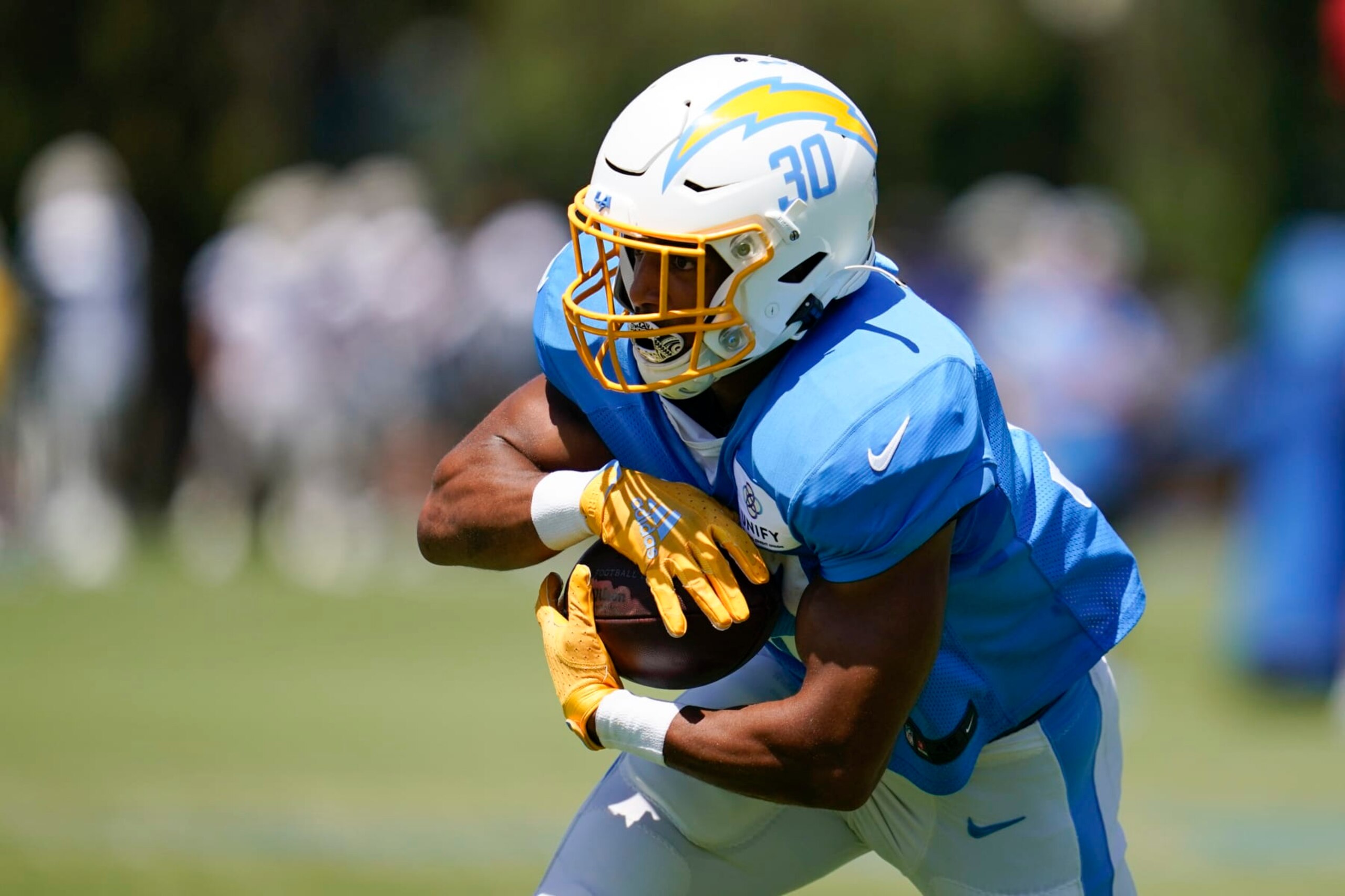 Los Angeles Chargers running back Austin Ekeler (30) participates in drills during a combined NFL practice with the Dallas Cowboys at the Los Angeles Rams' practice facility in Costa Mesa, Calif. Thursday, Aug. 18, 2022. (AP Photo/Ashley Landis) Los Angeles Chargers running back Austin Ekeler (30) participates in drills during a combined NFL practice with the Dallas Cowboys at the Los Angeles Rams' practice facility in Costa Mesa, Calif. Thursday, Aug. 18, 2022. (AP Photo/Ashley Landis)