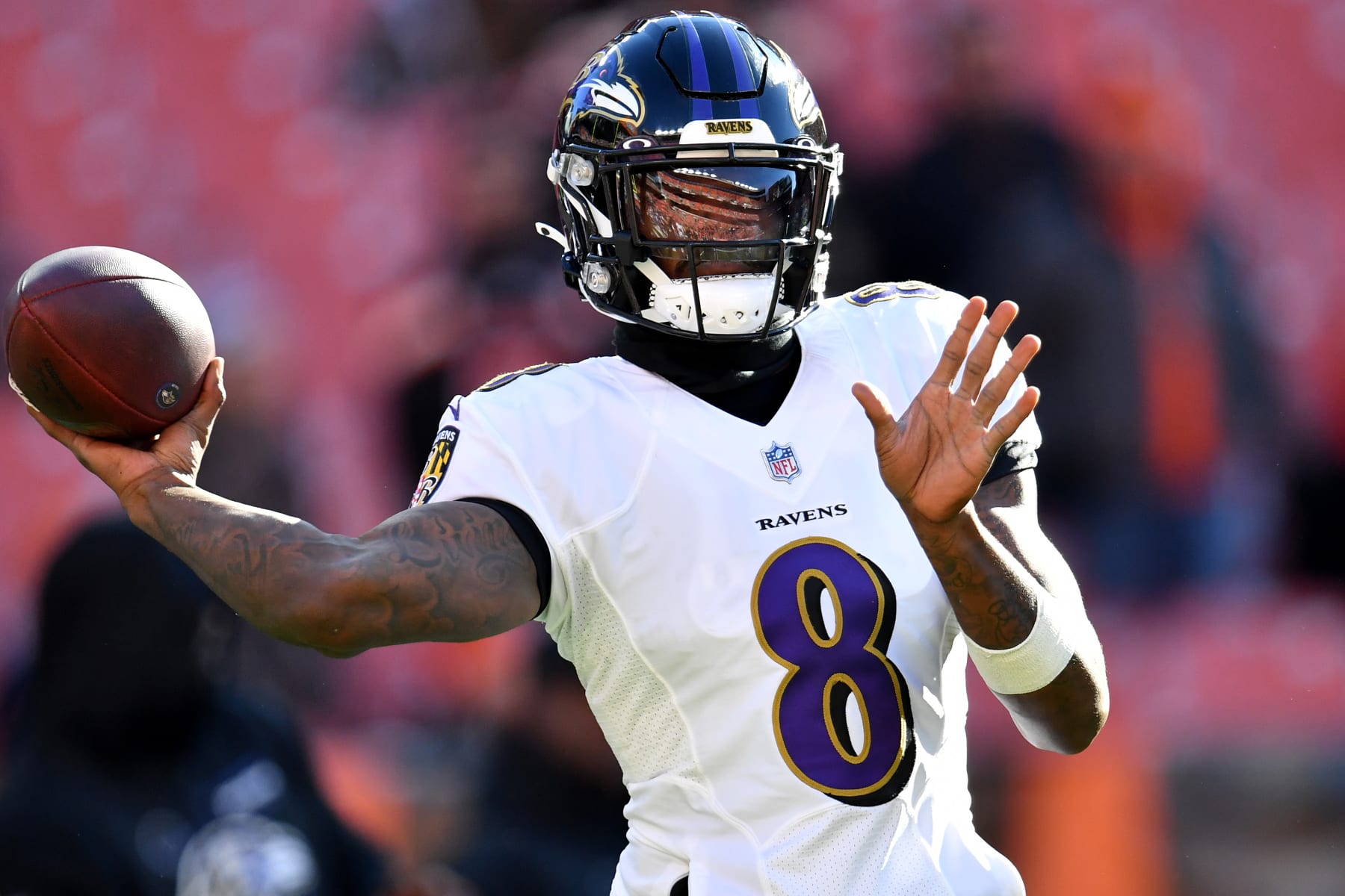 CLEVELAND, OHIO - DECEMBER 12: Lamar Jackson #8 of the Baltimore Ravens throws the ball during warm-up before the game against the Cleveland Browns at FirstEnergy Stadium on December 12, 2021 in Cleveland, Ohio. (Photo by Jason Miller/Getty Images)