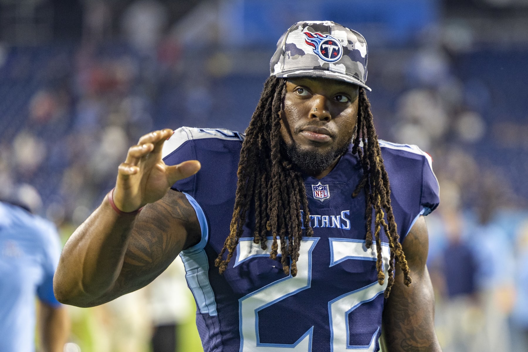 NASHVILLE, TENNESSEE - AUGUST 20: Derrick Henry #22 of the Tennessee Titans walks off the field after a preseason game against the Tampa Bay Buccaneers at Nissan Stadium on August 20, 2022 in Nashville, Tennessee. The Titans defeated the Buccaneers 13-3.  (Photo by Wesley Hitt/Getty Images)