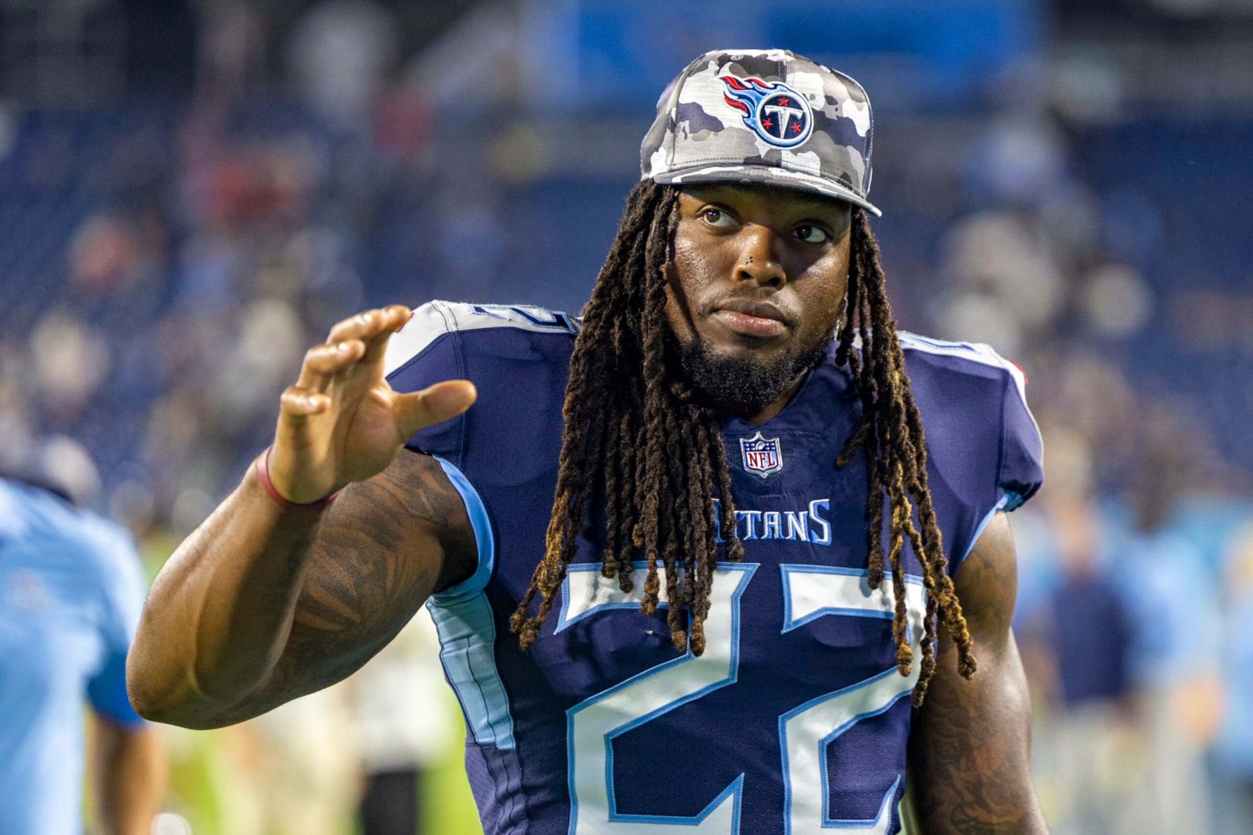 NASHVILLE, TENNESSEE - AUGUST 20: Derrick Henry #22 of the Tennessee Titans walks off the field after a preseason game against the Tampa Bay Buccaneers at Nissan Stadium on August 20, 2022 in Nashville, Tennessee. The Titans defeated the Buccaneers 13-3.  (Photo by Wesley Hitt/Getty Images)