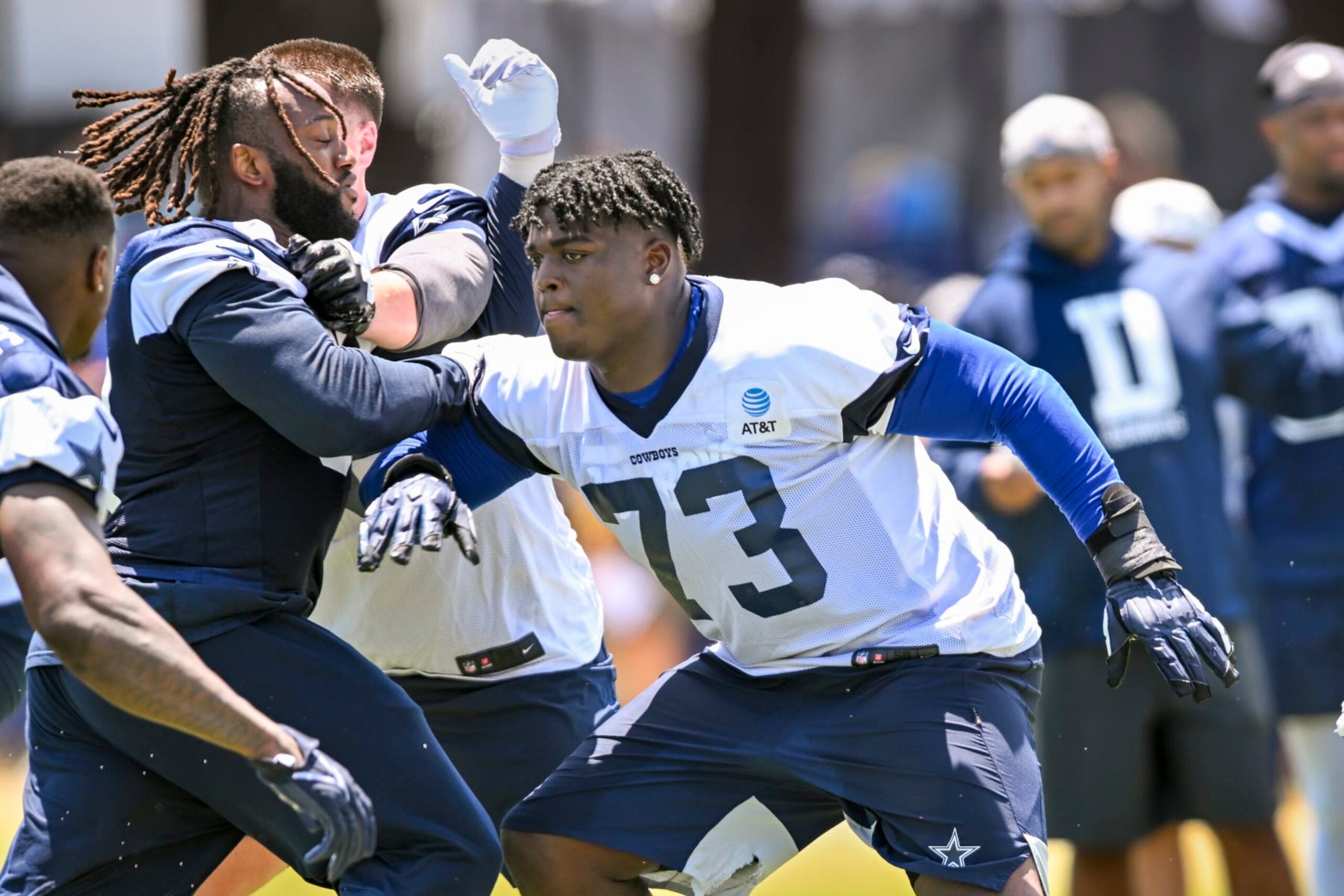 Dallas Cowboys defensive tackle Osa Odighizuwa, left, rushes offensive tackle Tyler Smith (73) as they run a play during NFL football training camp, Wednesday, July 27, 2022, in Oxnard, Calif. (AP Photo/Gus Ruelas) Dallas Cowboys defensive tackle Osa Odighizuwa, left, rushes offensive tackle Tyler Smith (73) as they run a play during NFL football training camp, Wednesday, July 27, 2022, in Oxnard, Calif. (AP Photo/Gus Ruelas)
