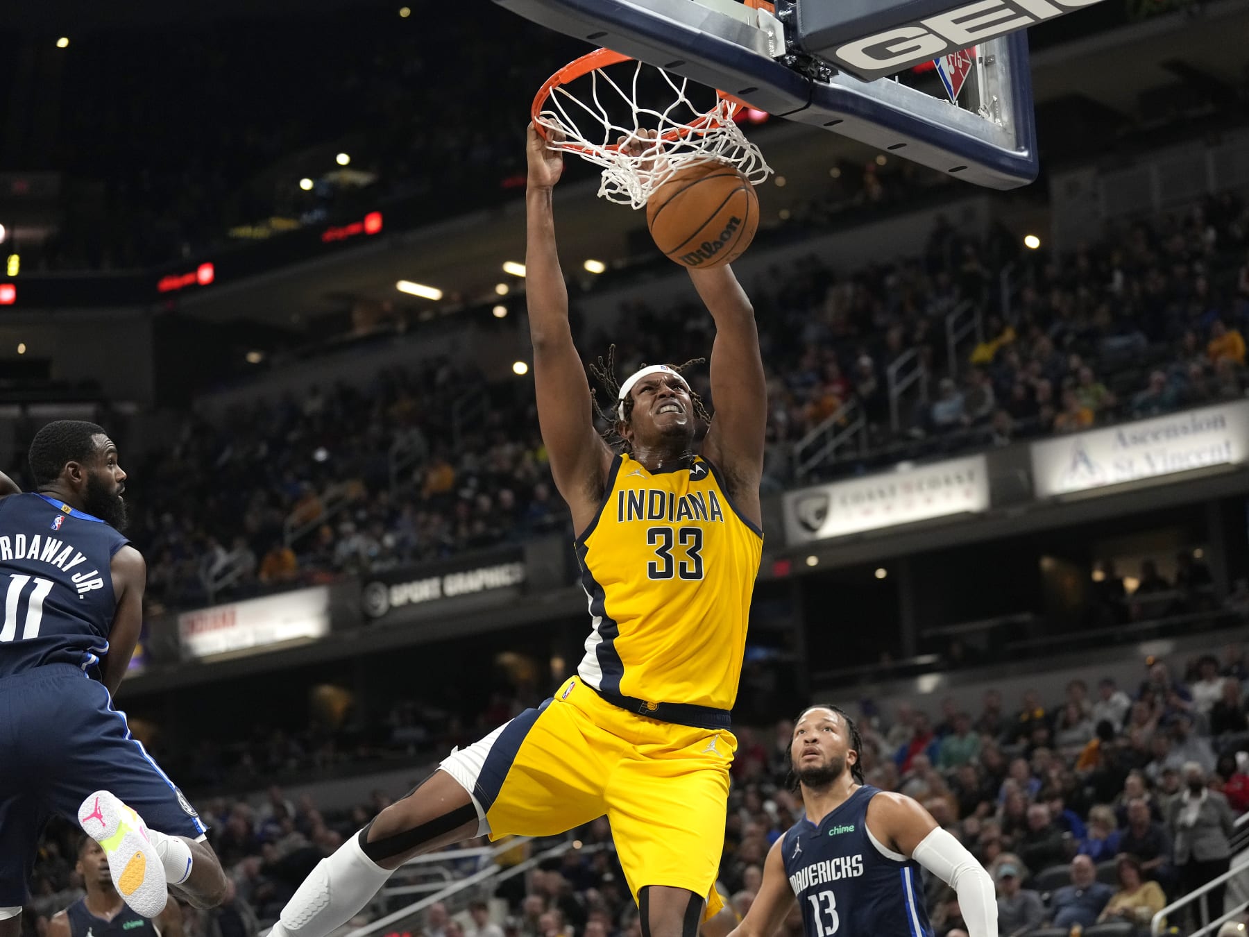 INDIANAPOLIS, IN - DECEMBER 10: (Dunk Sequence 3 of 4) Myles Turner #33 of the Indiana Pacers dunks the ball against the Dallas Mavericks on December 10, 2021 at Gainbridge Fieldhouse in Indianapolis, Indiana. NOTE TO USER: User expressly acknowledges and agrees that, by downloading and or using this Photograph, user is consenting to the terms and conditions of the Getty Images License Agreement. Mandatory Copyright Notice: Copyright 2021 NBAE (Photo by A.J. Mast/NBAE via Getty Images)