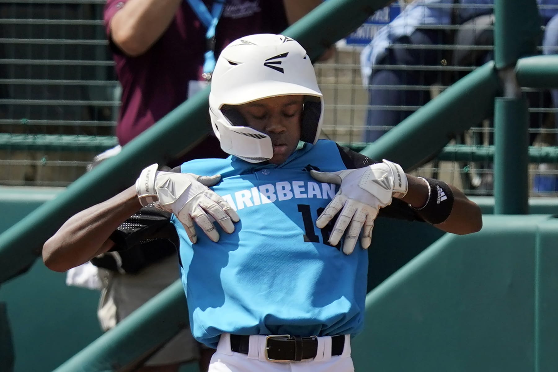 Curacao's Jaydion Louisa celebrates on first base after driving in a run during the third inning of the International Championship baseball game against Taiwan at the Little League World Series tournament in South Williamsport, Pa., Saturday, Aug. 27, 2022. (AP Photo/Gene J. Puskar)