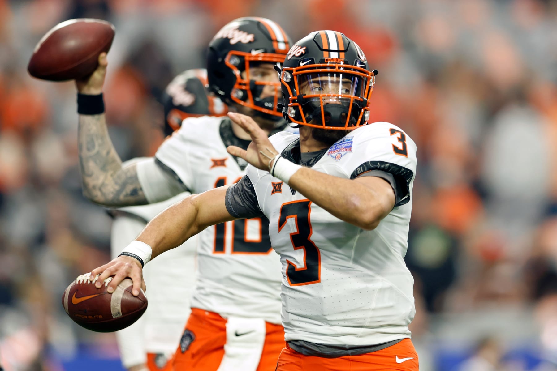 GLENDALE, ARIZONA - JANUARY 01: Spencer Sanders #3 of the Oklahoma State Cowboys warms up before the PlayStation Fiesta Bowl against the Notre Dame Fighting Irish at State Farm Stadium on January 01, 2022 in Glendale, Arizona. (Photo by Christian Petersen/Getty Images)