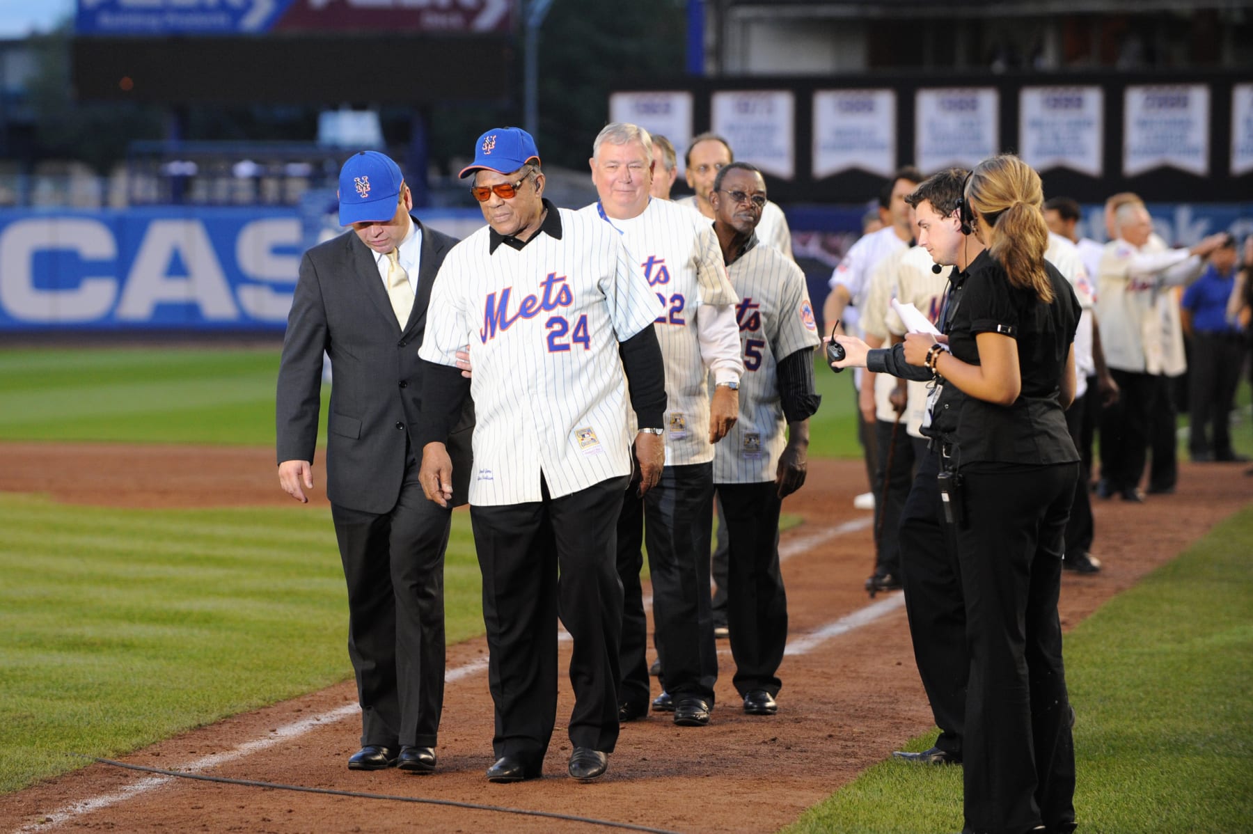 NEW YORK - SEPTEMBER 28:  Former New York Mets players Willie Mays and Ray Knight walk onto the field after the game against the Florida Marlins to commemorate the last regular season baseball game ever played in Shea Stadium on September 28, 2008 in the Flushing neighborhood of the Queens borough of New York City. The Mets plan to start next season at their new stadium Citi Field after playing in Shea for over 44 years. (Photo by: Al Bello/Getty Images)