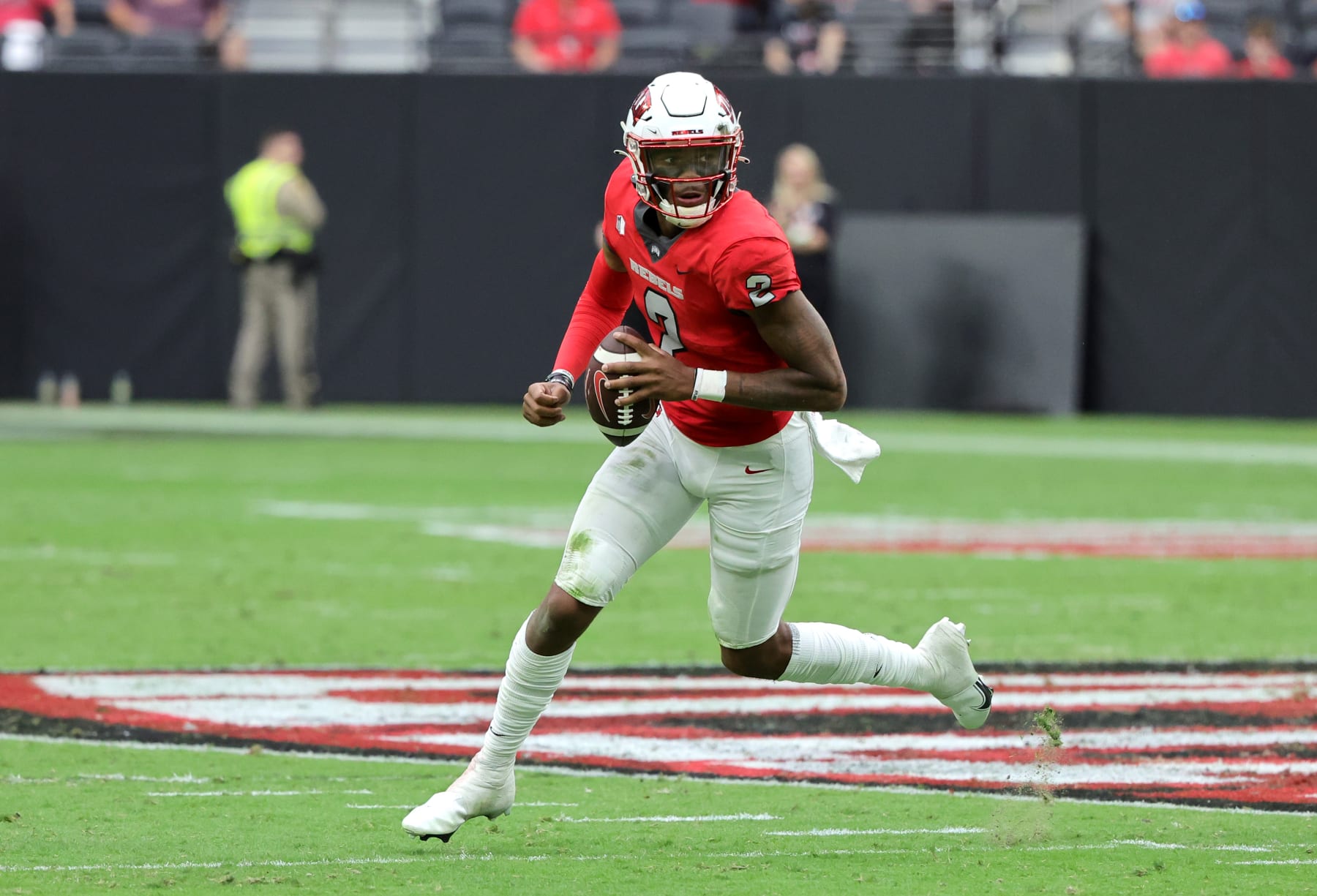 LAS VEGAS, NEVADA - AUGUST 27: Quarterback Doug Brumfield #2 of the UNLV Rebels scrambles against the Idaho State Bengals during their game at Allegiant Stadium on August 27, 2022 in Las Vegas, Nevada. The Rebels defeated the Bengals 52-21. (Photo by Ethan Miller/Getty Images)