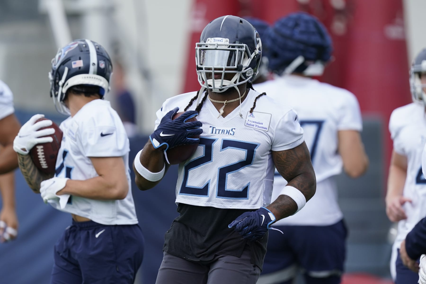 Tennessee Titans running back Derrick Henry (22) takes part in drills during training camp at the NFL football team's practice facility Wednesday, July 27, 2022, in Nashville, Tenn. (AP Photo/Mark Humphrey)