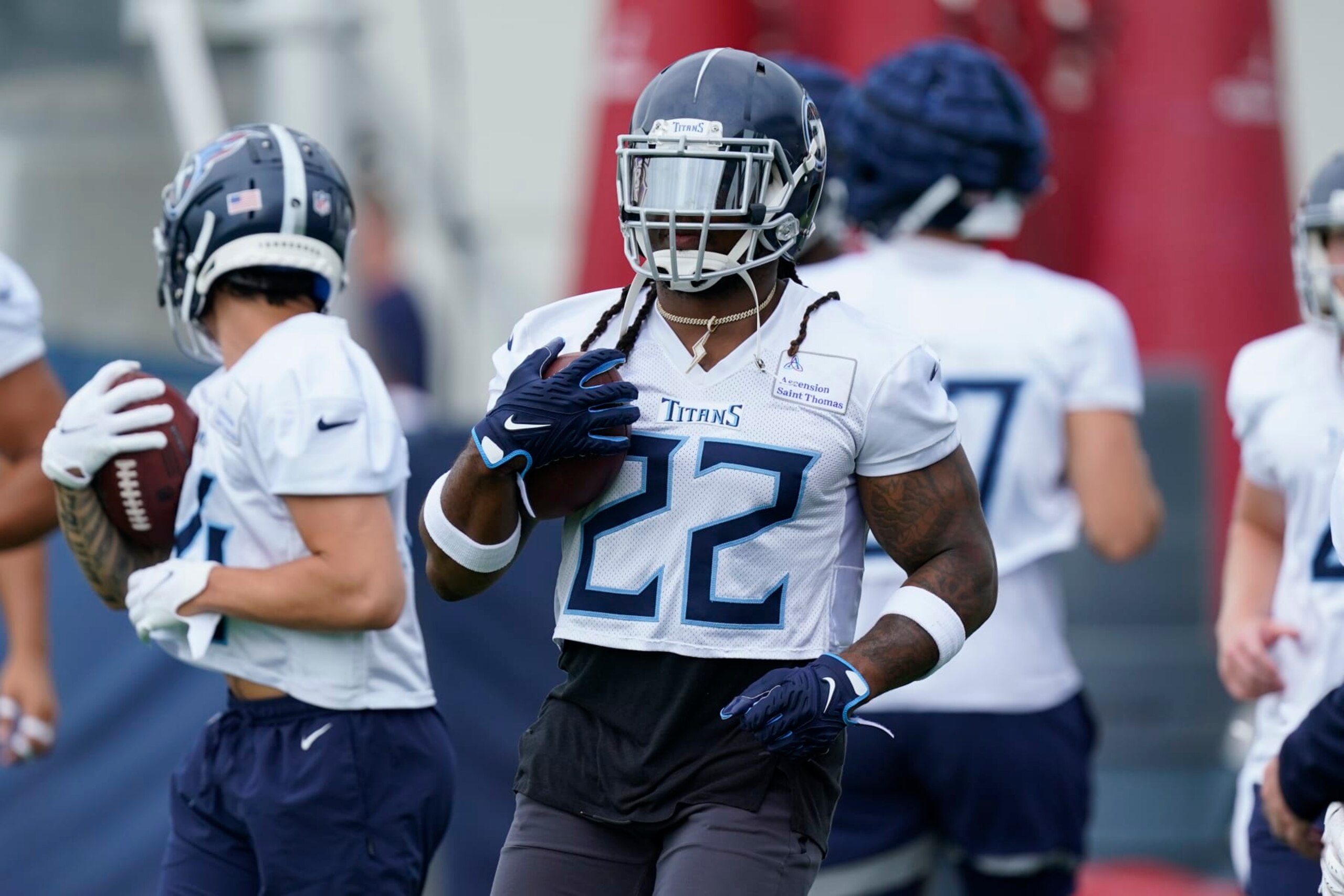 Tennessee Titans running back Derrick Henry (22) takes part in drills during training camp at the NFL football team's practice facility Wednesday, July 27, 2022, in Nashville, Tenn. (AP Photo/Mark Humphrey)