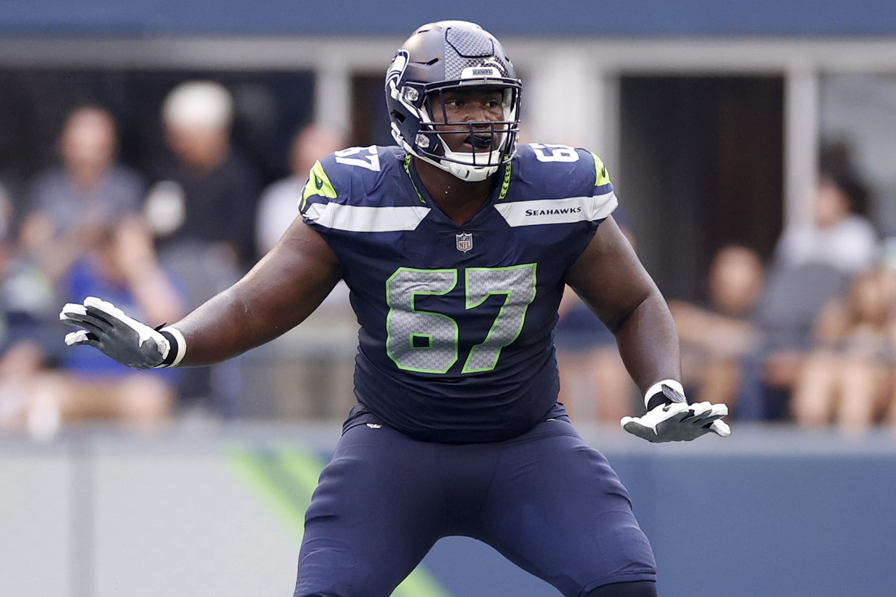 SEATTLE, WASHINGTON - AUGUST 18: Charles Cross #67 of the Seattle Seahawks looks to block during the preseason game against the Chicago Bears at Lumen Field on August 18, 2022 in Seattle, Washington. (Photo by Steph Chambers/Getty Images)