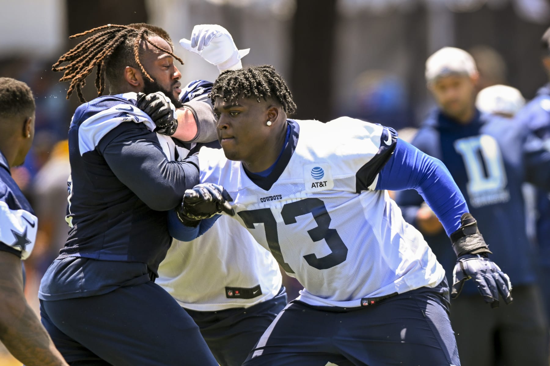 Dallas Cowboys defensive tackle Osa Odighizuwa, left, rushes against offensive tackle Tyler Smith (73) during NFL football training camp Wednesday, July 27, 2022, in Oxnard, Calif. (AP Photo/Gus Ruelas)