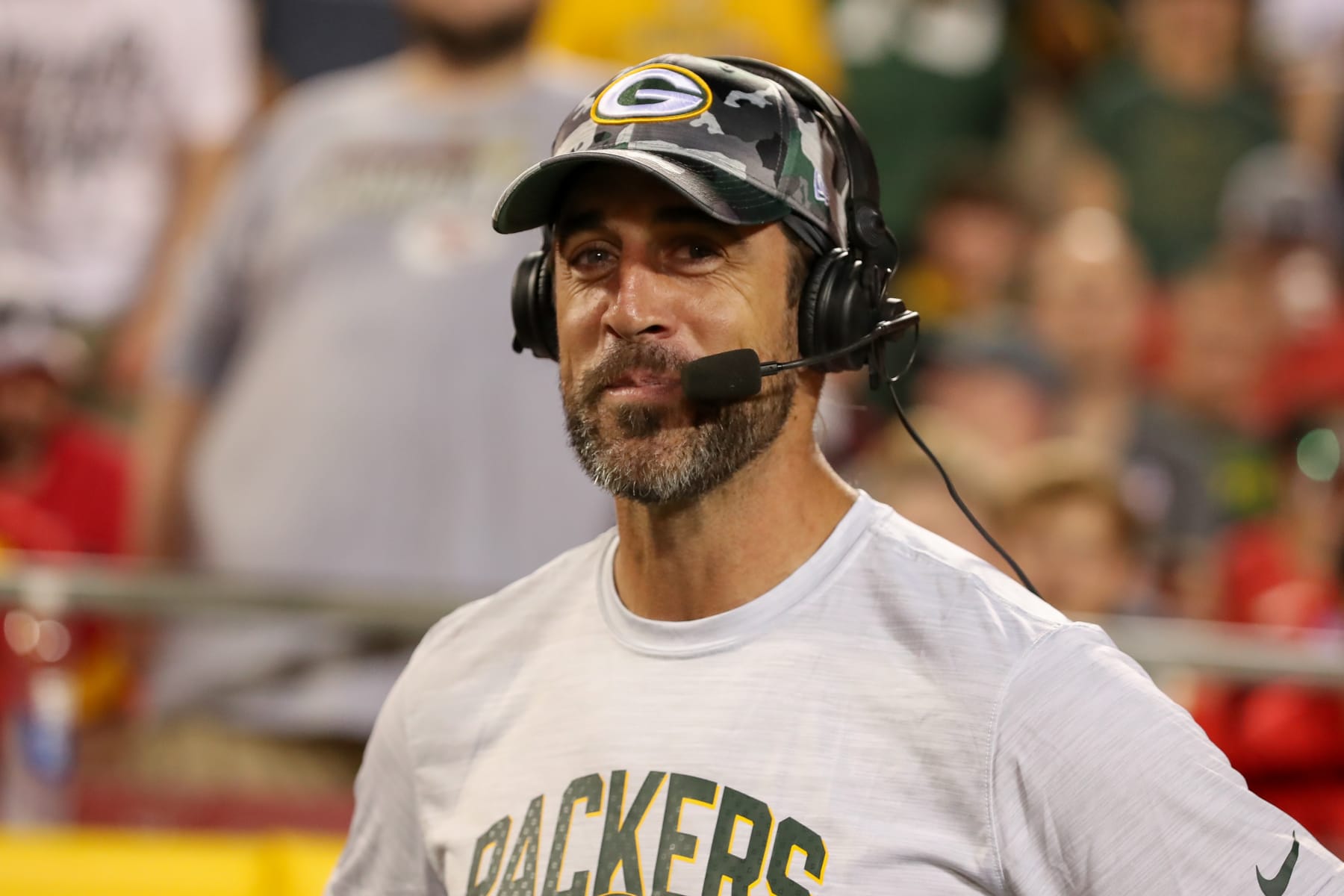 KANSAS CITY, MO - AUGUST 25: Green Bay Packers quarterback Aaron Rodgers (12) is interviewed on the sidelines in the second half of an NFL preseason game between the Green Bay Packers and Kansas City Chiefs on August 25, 2022 at GEHA Field at Arrowhead Stadium in Kansas City, MO. (Photo by Scott Winters/Icon Sportswire via Getty Images)