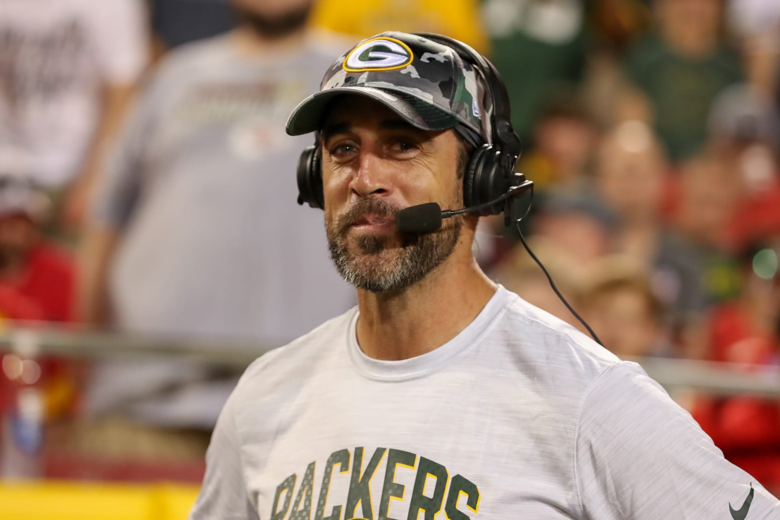 KANSAS CITY, MO - AUGUST 25: Green Bay Packers quarterback Aaron Rodgers (12) is interviewed on the sidelines in the second half of an NFL preseason game between the Green Bay Packers and Kansas City Chiefs on August 25, 2022 at GEHA Field at Arrowhead Stadium in Kansas City, MO. (Photo by Scott Winters/Icon Sportswire via Getty Images)