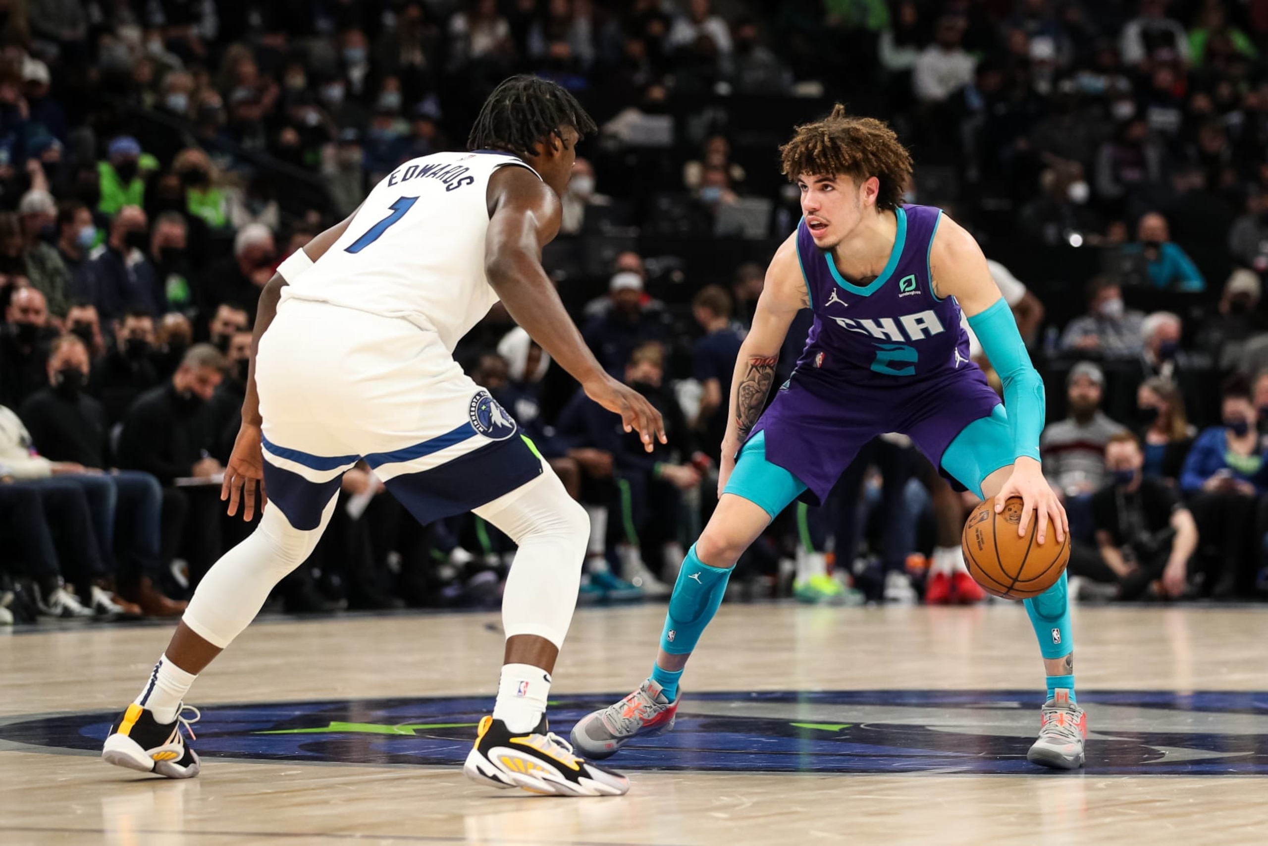 MINNEAPOLIS, MN - FEBRUARY 15: LaMelo Ball #2 of the Charlotte Hornets dribbles the ball while Anthony Edwards #1 of the Minnesota Timberwolves defends in the second quarter of the game at Target Center on February 15, 2022 in Minneapolis, Minnesota. The Timberwolves defeated the Hornets 126-120 in overtime. NOTE TO USER: User expressly acknowledges and agrees that, by downloading and or using this Photograph, user is consenting to the terms and conditions of the Getty Images License Agreement. (Photo by David Berding/Getty Images) MINNEAPOLIS, MN - FEBRUARY 15: LaMelo Ball #2 of the Charlotte Hornets dribbles the ball while Anthony Edwards #1 of the Minnesota Timberwolves defends in the second quarter of the game at Target Center on February 15, 2022 in Minneapolis, Minnesota. The Timberwolves defeated the Hornets 126-120 in overtime. NOTE TO USER: User expressly acknowledges and agrees that, by downloading and or using this Photograph, user is consenting to the terms and conditions of the Getty Images License Agreement. (Photo by David Berding/Getty Images)