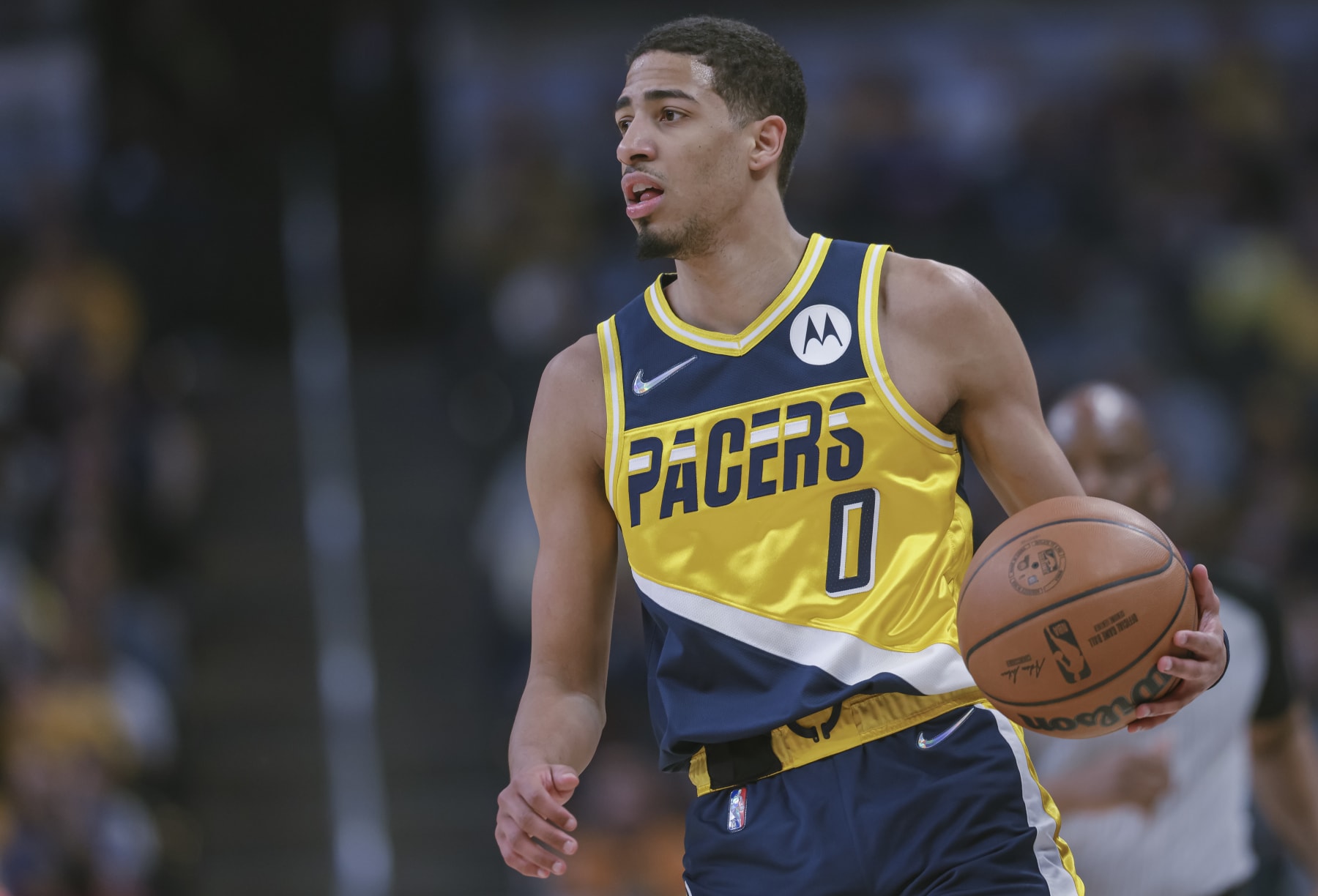 INDIANAPOLIS, IN - APRIL 03: Tyrese Haliburton #0 of the Indiana Pacers brings the ball up court during the game against the Detroit Pistons at Gainbridge Fieldhouse on April 3, 2022 in Indianapolis, Indiana. NOTE TO USER: User expressly acknowledges and agrees that, by downloading and or using this photograph, User is consenting to the terms and conditions of the Getty Images License Agreement. (Photo by Michael Hickey/Getty Images)