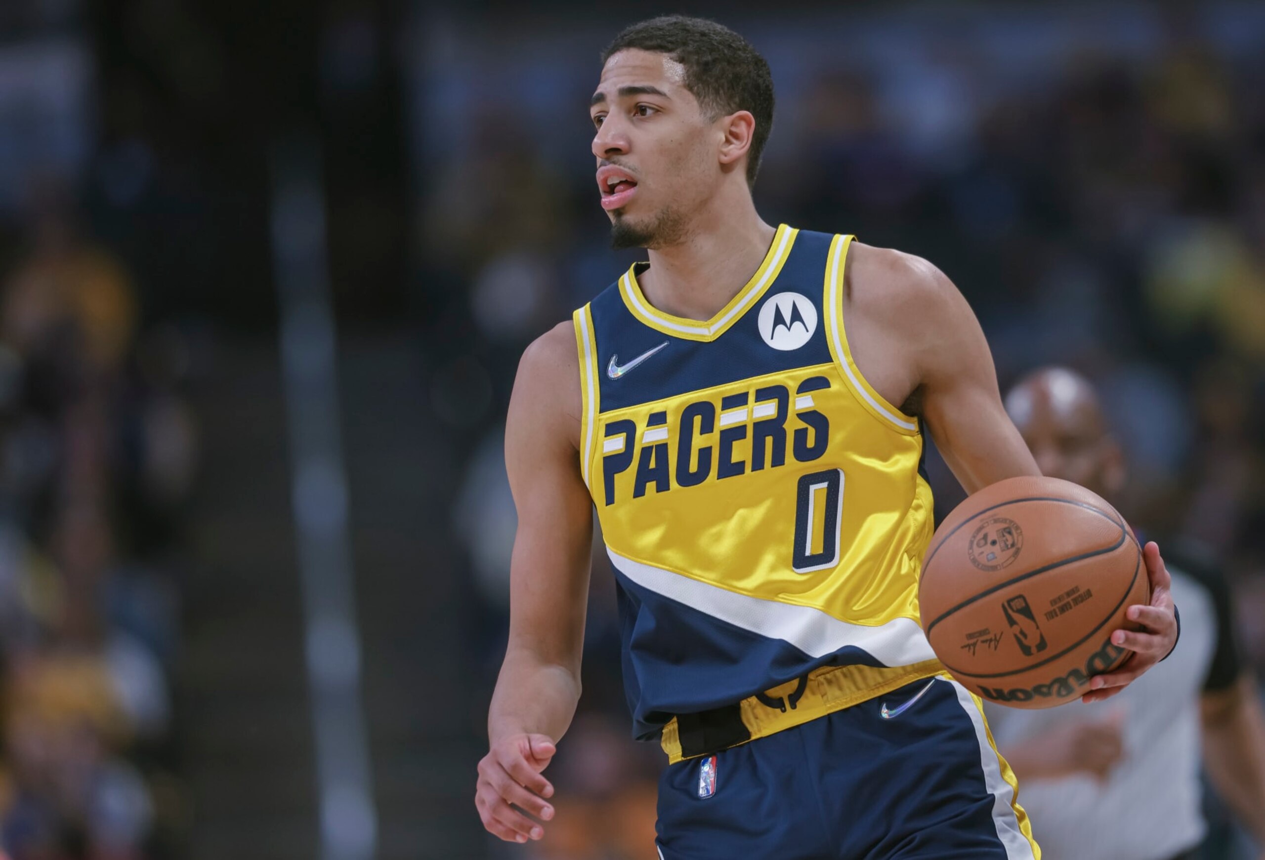 INDIANAPOLIS, IN - APRIL 03: Tyrese Haliburton #0 of the Indiana Pacers brings the ball up court during the game against the Detroit Pistons at Gainbridge Fieldhouse on April 3, 2022 in Indianapolis, Indiana. NOTE TO USER: User expressly acknowledges and agrees that, by downloading and or using this photograph, User is consenting to the terms and conditions of the Getty Images License Agreement. (Photo by Michael Hickey/Getty Images) INDIANAPOLIS, IN - APRIL 03: Tyrese Haliburton #0 of the Indiana Pacers brings the ball up court during the game against the Detroit Pistons at Gainbridge Fieldhouse on April 3, 2022 in Indianapolis, Indiana. NOTE TO USER: User expressly acknowledges and agrees that, by downloading and or using this photograph, User is consenting to the terms and conditions of the Getty Images License Agreement. (Photo by Michael Hickey/Getty Images)