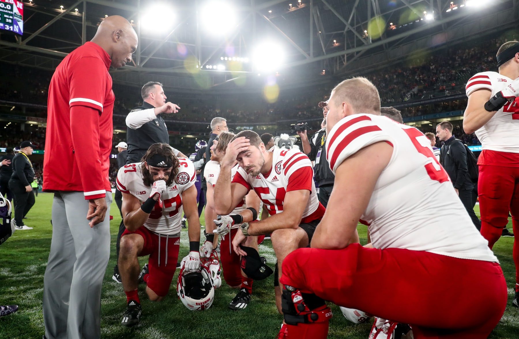 DUBLIN, IRELAND - AUGUST 27:  Ron Brown consoles players at full time after the Aer Lingus College Football Classic 2022 match between Northwestern Wildcats and Nebraska Cornhuskersat Aviva Stadium on August 27, 2022 in Dublin, Ireland. (Photo by Oisin Keniry/Getty Images)