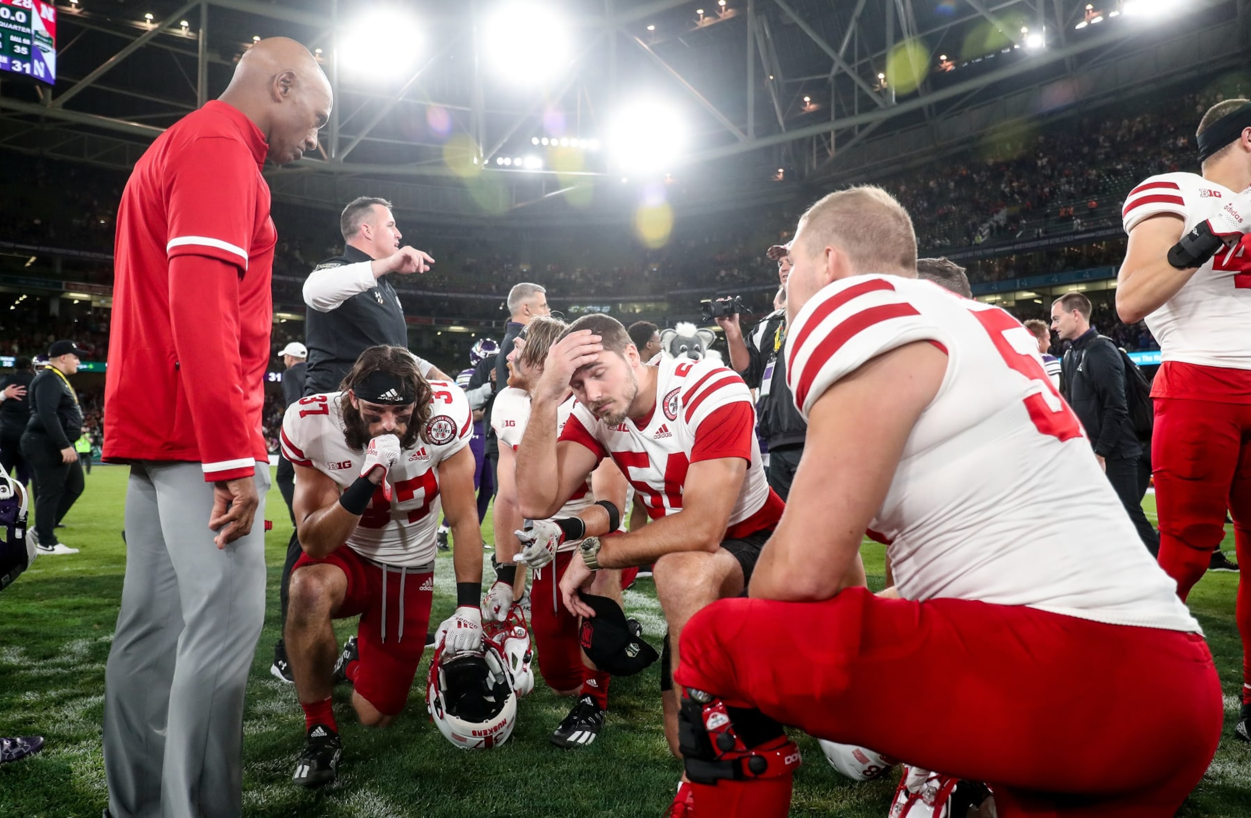 DUBLIN, IRELAND - AUGUST 27:  Ron Brown consoles players at full time after the Aer Lingus College Football Classic 2022 match between Northwestern Wildcats and Nebraska Cornhuskersat Aviva Stadium on August 27, 2022 in Dublin, Ireland. (Photo by Oisin Keniry/Getty Images)