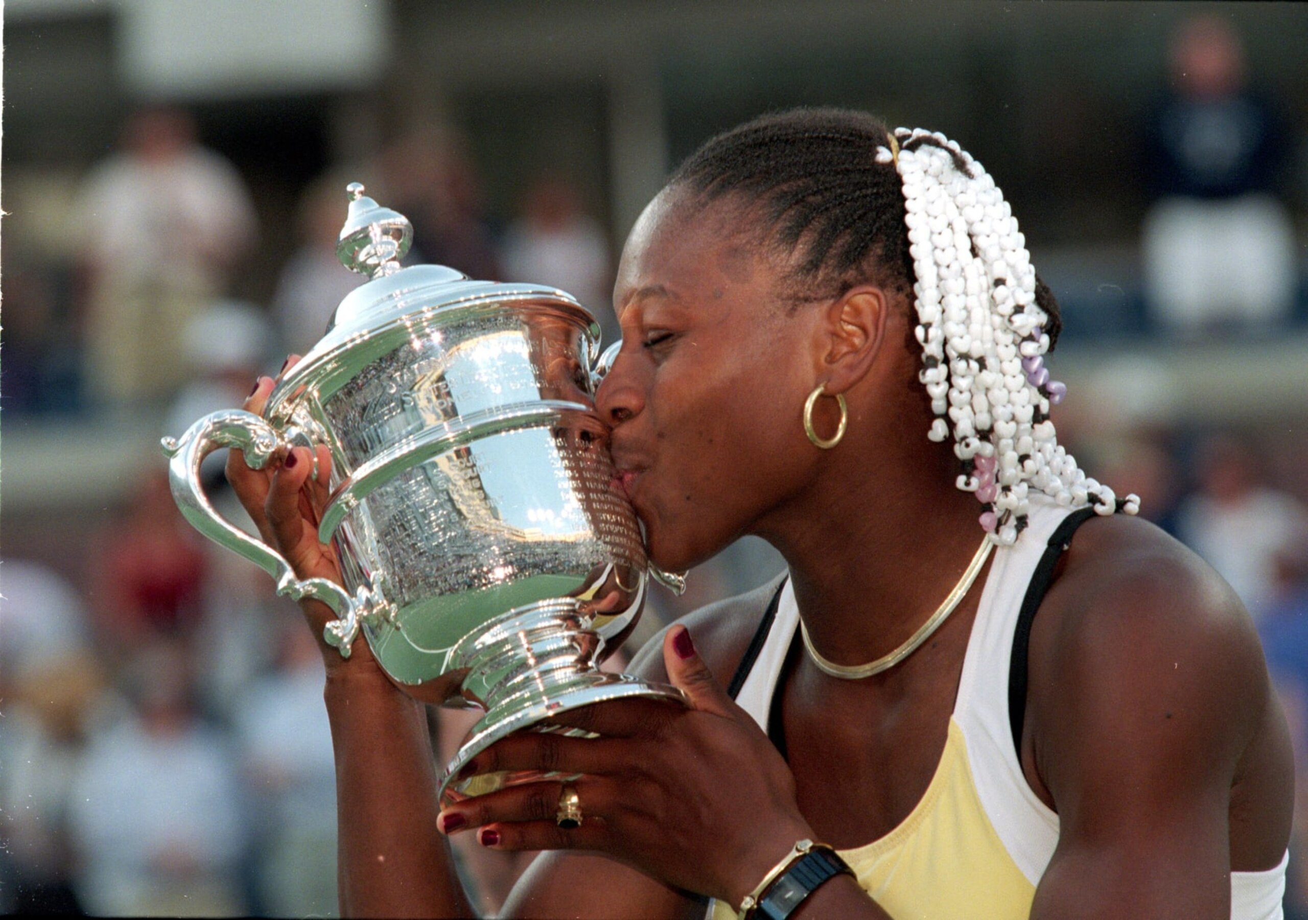 11 Sep 1999: American tennis player Serena Williams kisses her trophy after winning a match (against Martina Hingis of Switzerland) during the US Open at the USTA National Tennis Courts in Flushing Meadows, New York. Williams defeated Hingis 6-3, 7-6, 7-4. Mandatory Credit: Jamie Squire /Allsport 11 Sep 1999: American tennis player Serena Williams kisses her trophy after winning a match (against Martina Hingis of Switzerland) during the US Open at the USTA National Tennis Courts in Flushing Meadows, New York. Williams defeated Hingis 6-3, 7-6, 7-4. Mandatory Credit: Jamie Squire /Allsport