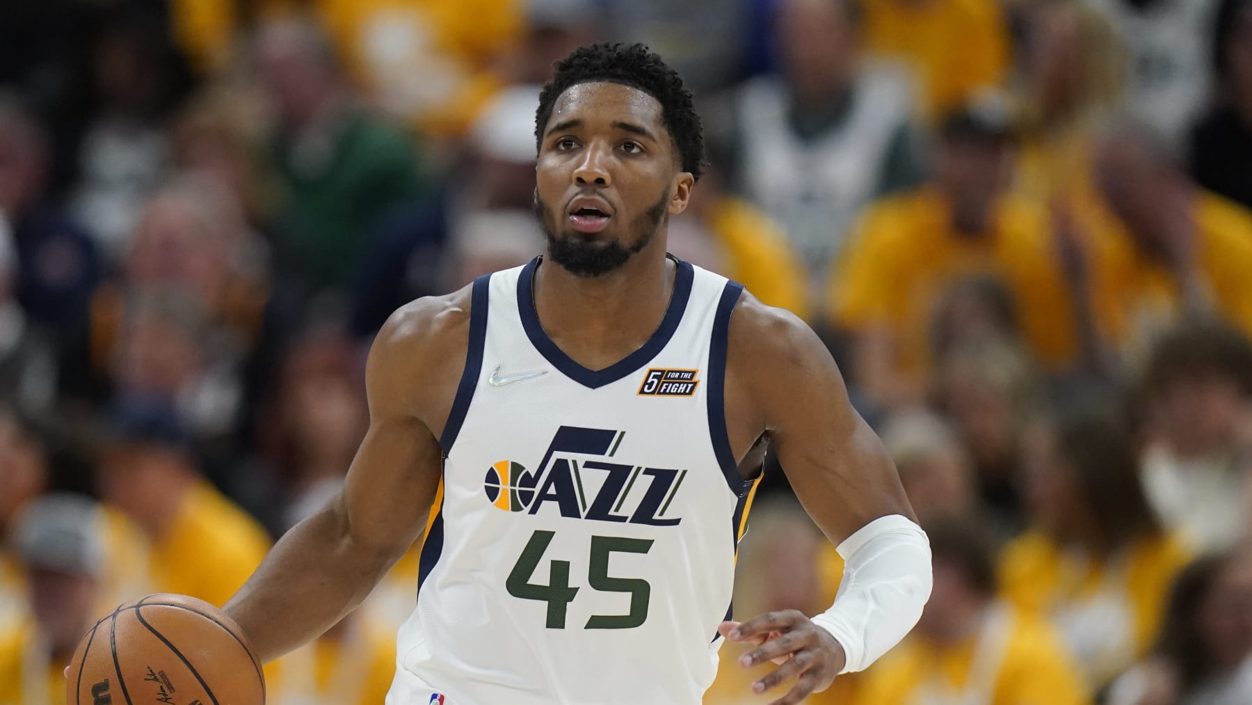 Utah Jazz guard Donovan Mitchell (45) brings the ball up court in the second half of Game 4 of an NBA basketball first-round playoff series against the Dallas Mavericks Saturday, April 23, 2022, in Salt Lake City. (AP Photo/Rick Bowmer)