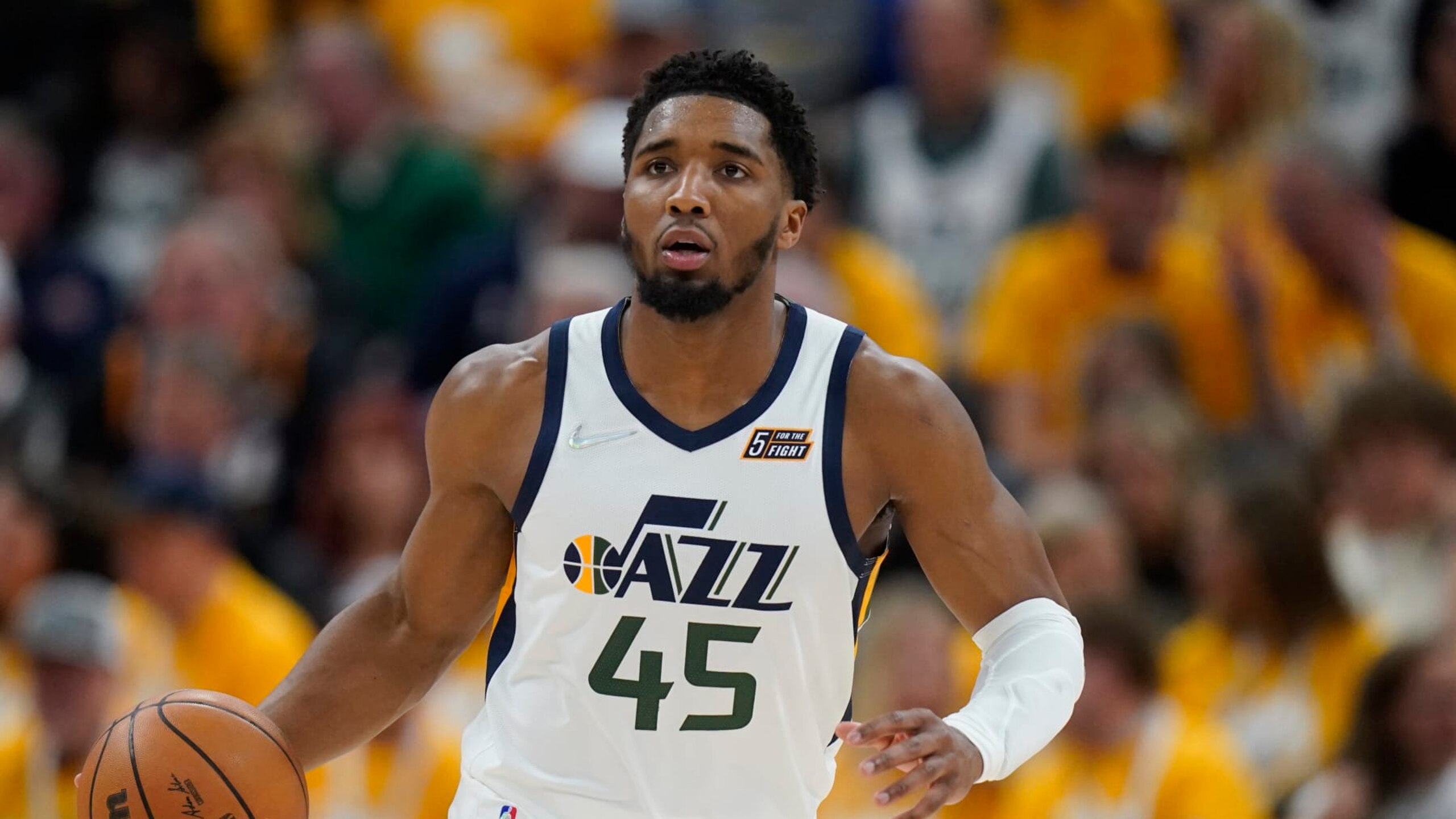 Utah Jazz guard Donovan Mitchell (45) brings the ball up court in the second half of Game 4 of an NBA basketball first-round playoff series against the Dallas Mavericks Saturday, April 23, 2022, in Salt Lake City. (AP Photo/Rick Bowmer)