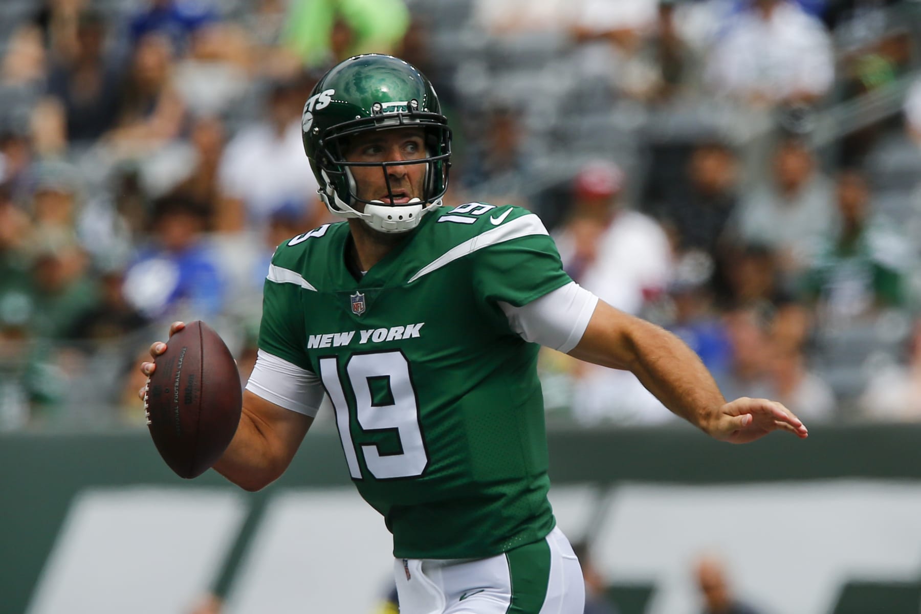 New York Jets quarterback Joe Flacco (19) looks to pass on the run in the first half of a preseason NFL football game against the New York Giants, Sunday, Aug. 28, 2022, in East Rutherford, N.J. (AP Photo/John Munson)