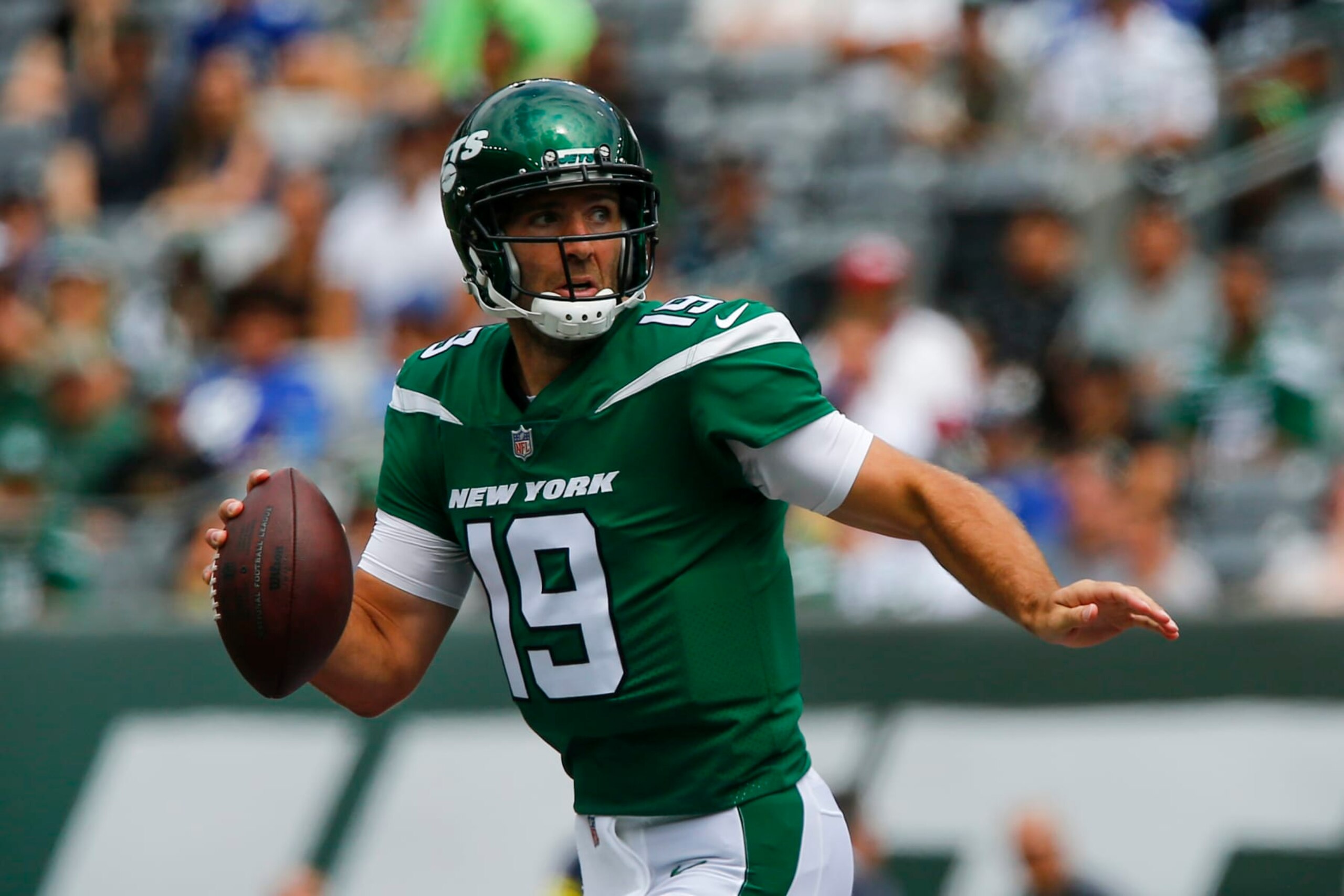 New York Jets quarterback Joe Flacco (19) looks to pass on the run in the first half of a preseason NFL football game against the New York Giants, Sunday, Aug. 28, 2022, in East Rutherford, N.J. (AP Photo/John Munson) New York Jets quarterback Joe Flacco (19) looks to pass on the run in the first half of a preseason NFL football game against the New York Giants, Sunday, Aug. 28, 2022, in East Rutherford, N.J. (AP Photo/John Munson)